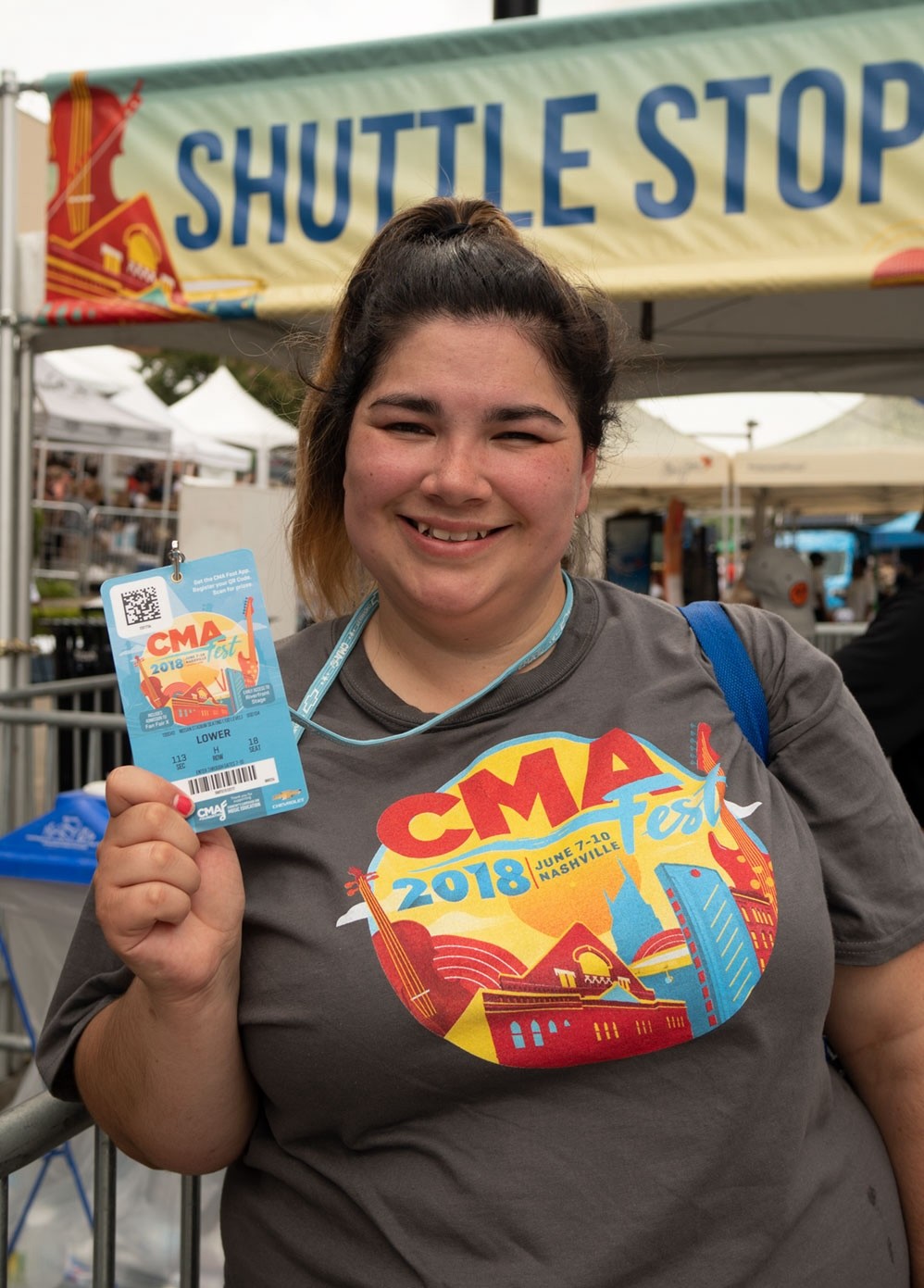 CMA Fest 2018 attendee proudly displaying event badge, showcasing fan engagement and immersive brand experience at Nashville’s premier country music festival.