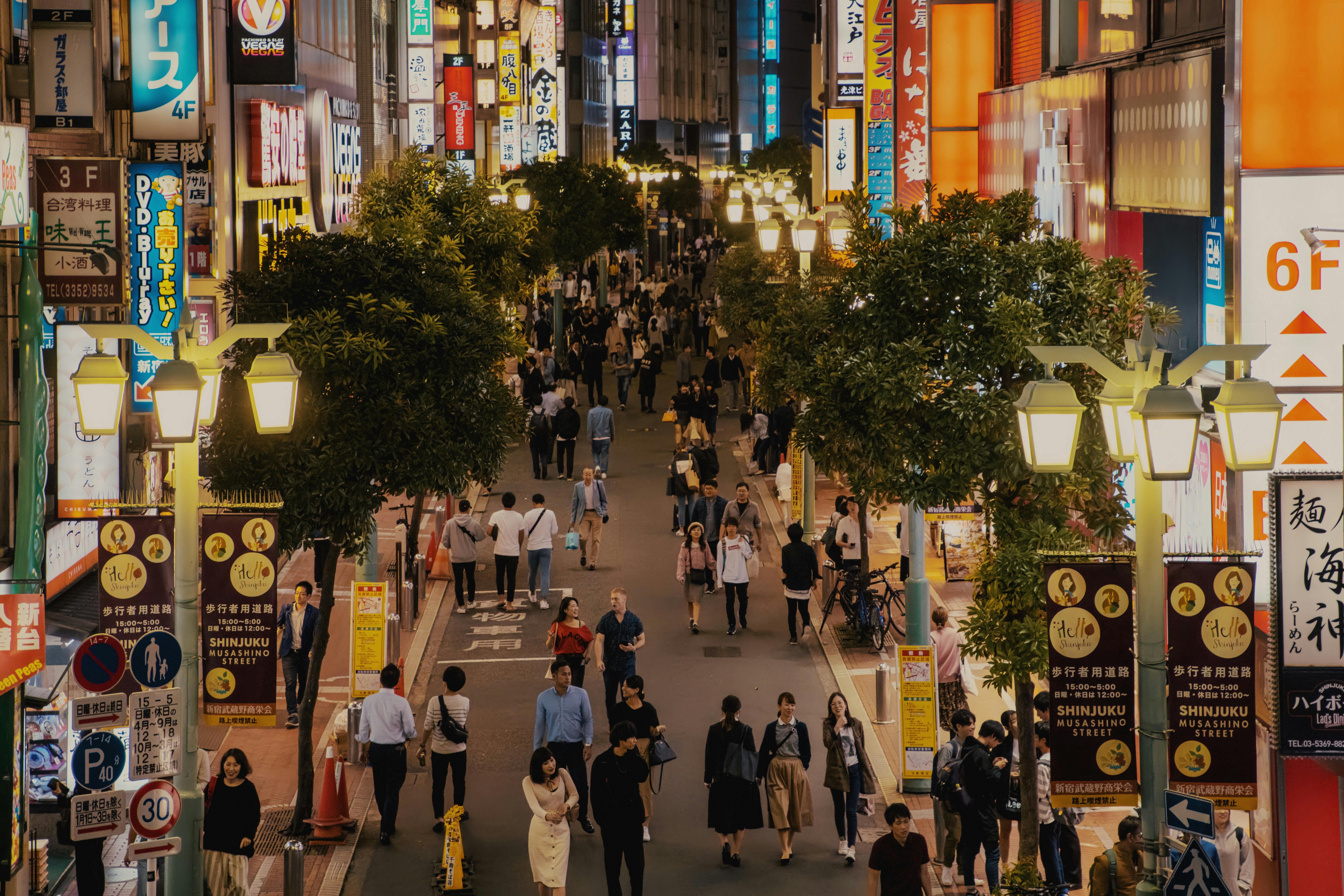 crowded street in Shinjuku with people walking