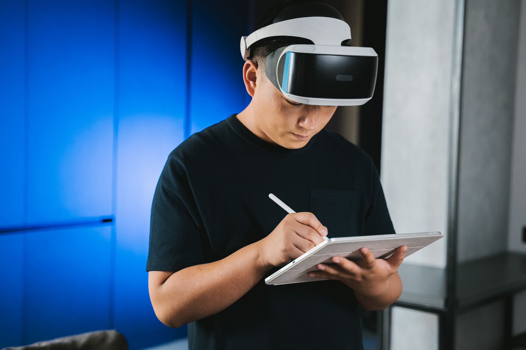 Man using a VR headset and tablet