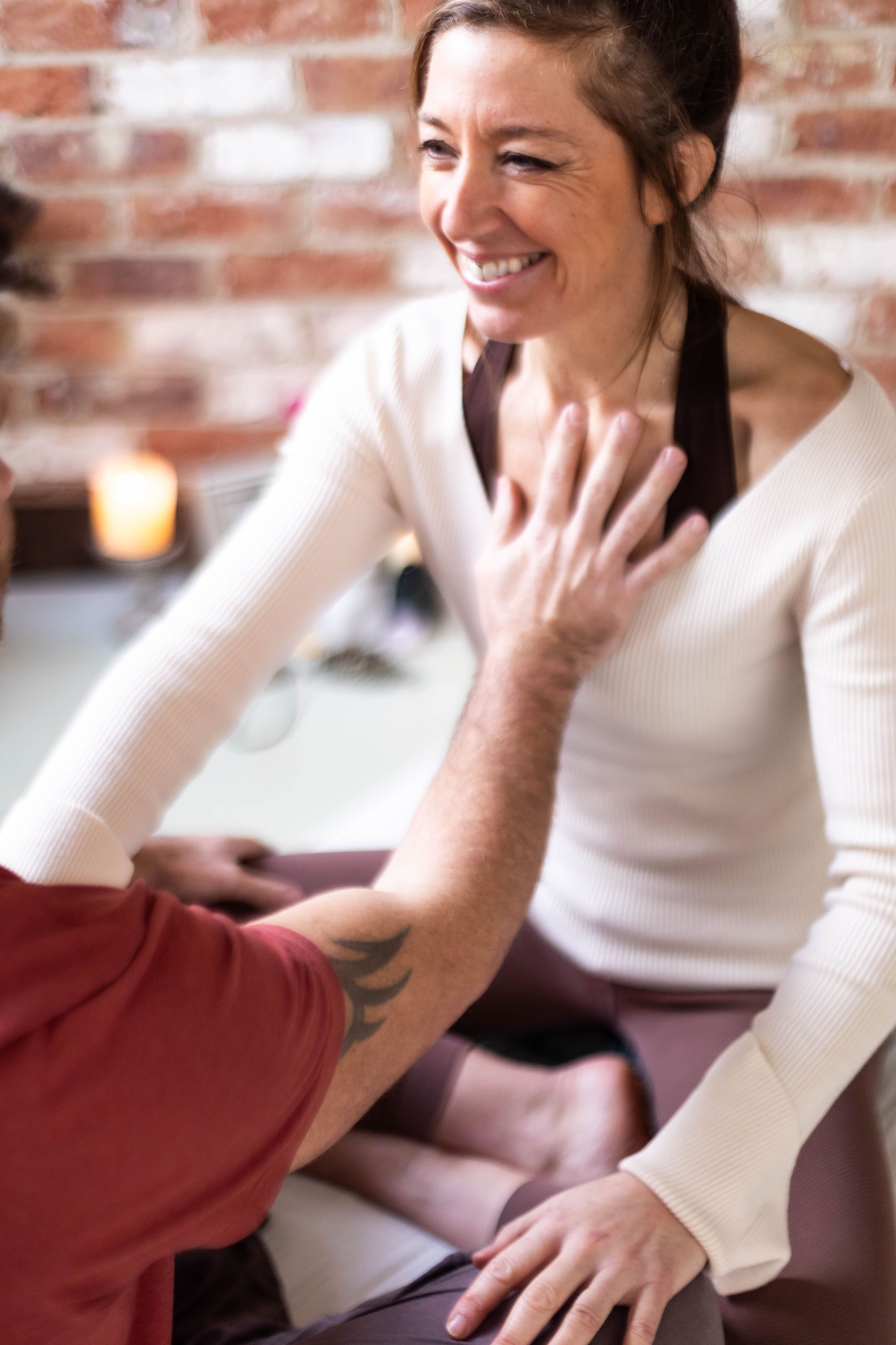 man touching woman's heart area