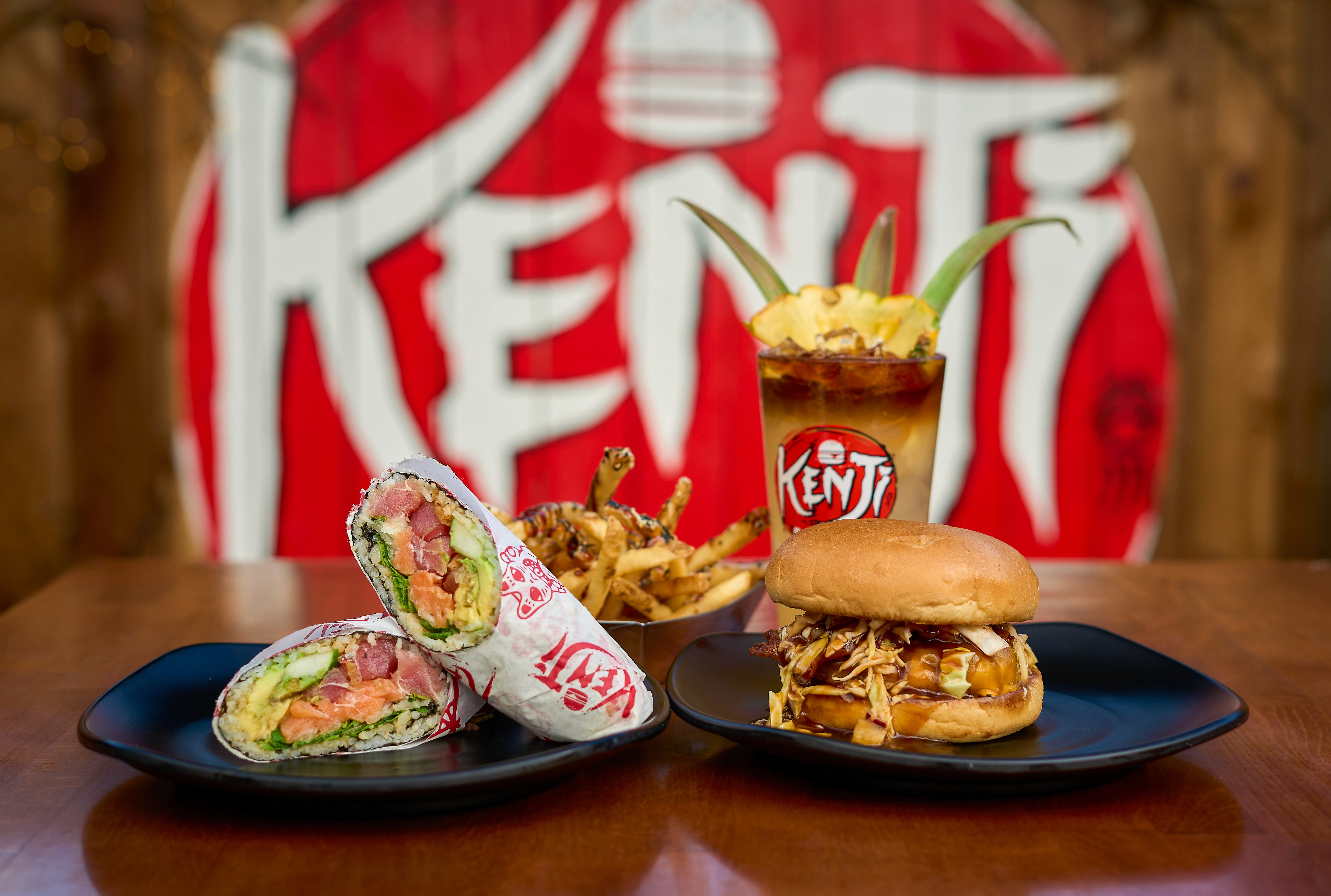 A beautifully arranged table with various dishes, including fruits, bread, and wine, set for a meal.