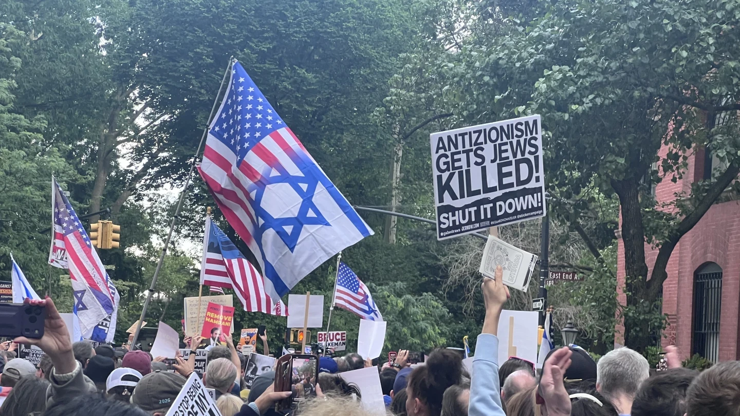 A protest sign reads 'Stop Mamdani' outside Gracie Mansion. Photo courtesy of Debra Nussbaum Cohen.