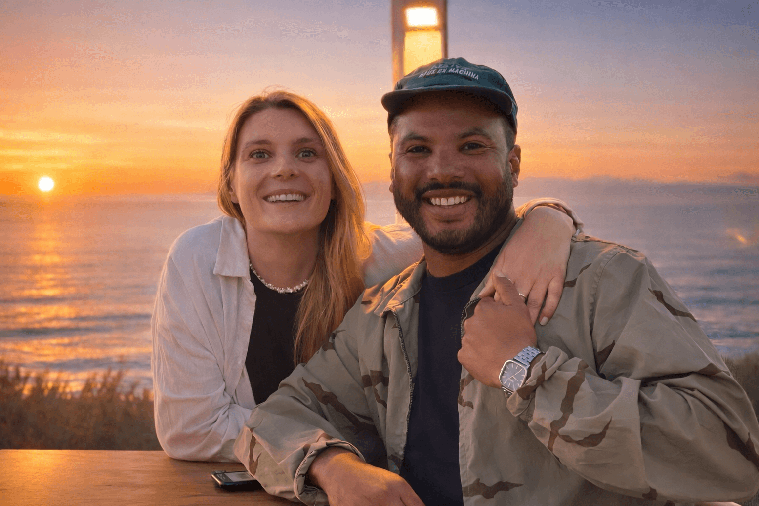 Couple portrait with dog on field