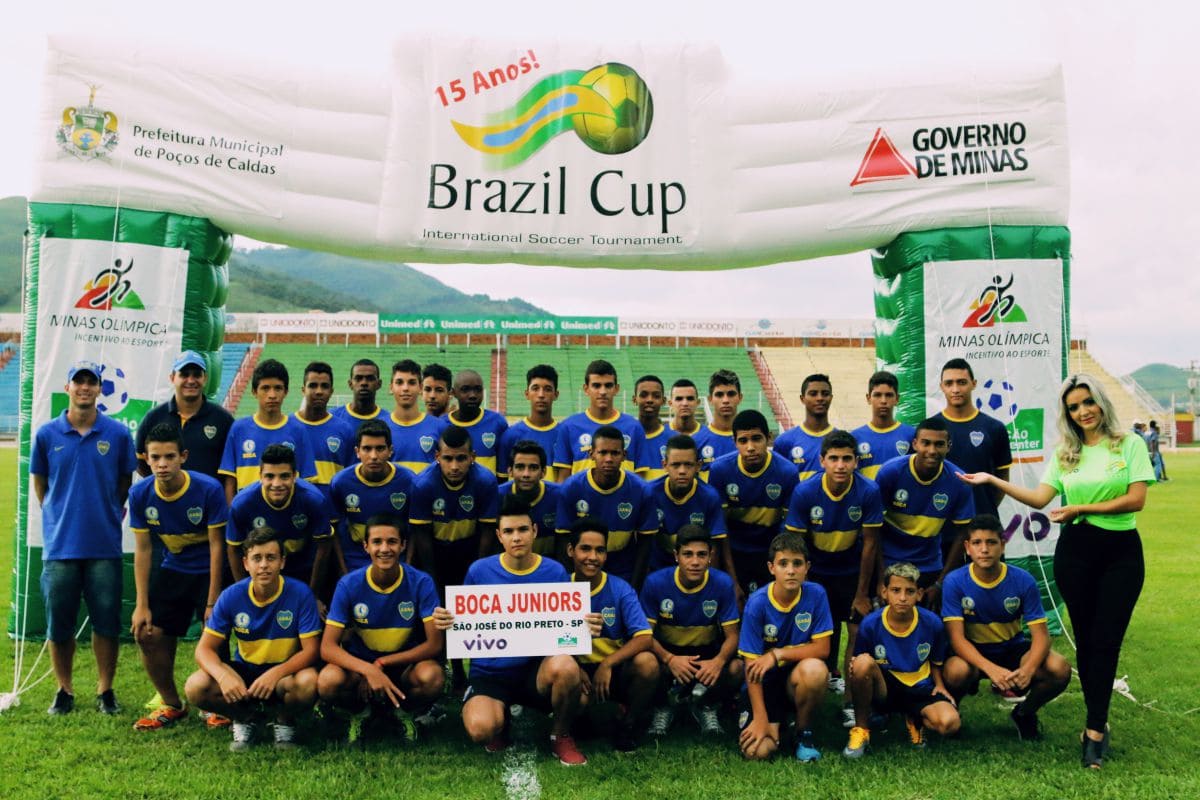 Portrait shot of middle aged female doctor sitting at desk and working in office