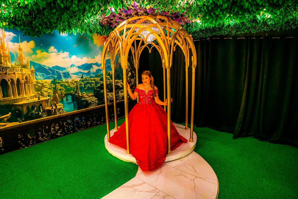 Debutante in red inside the golden gazebo of Pandora Hall, Quezon City