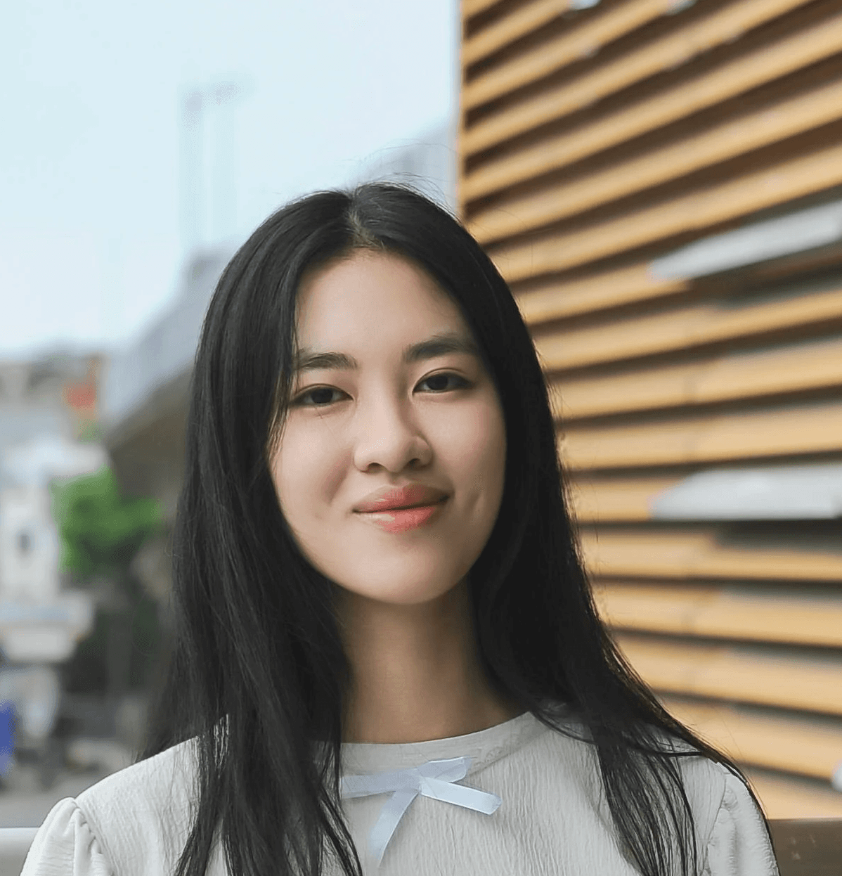 a woman standing on a pier next to the ocean