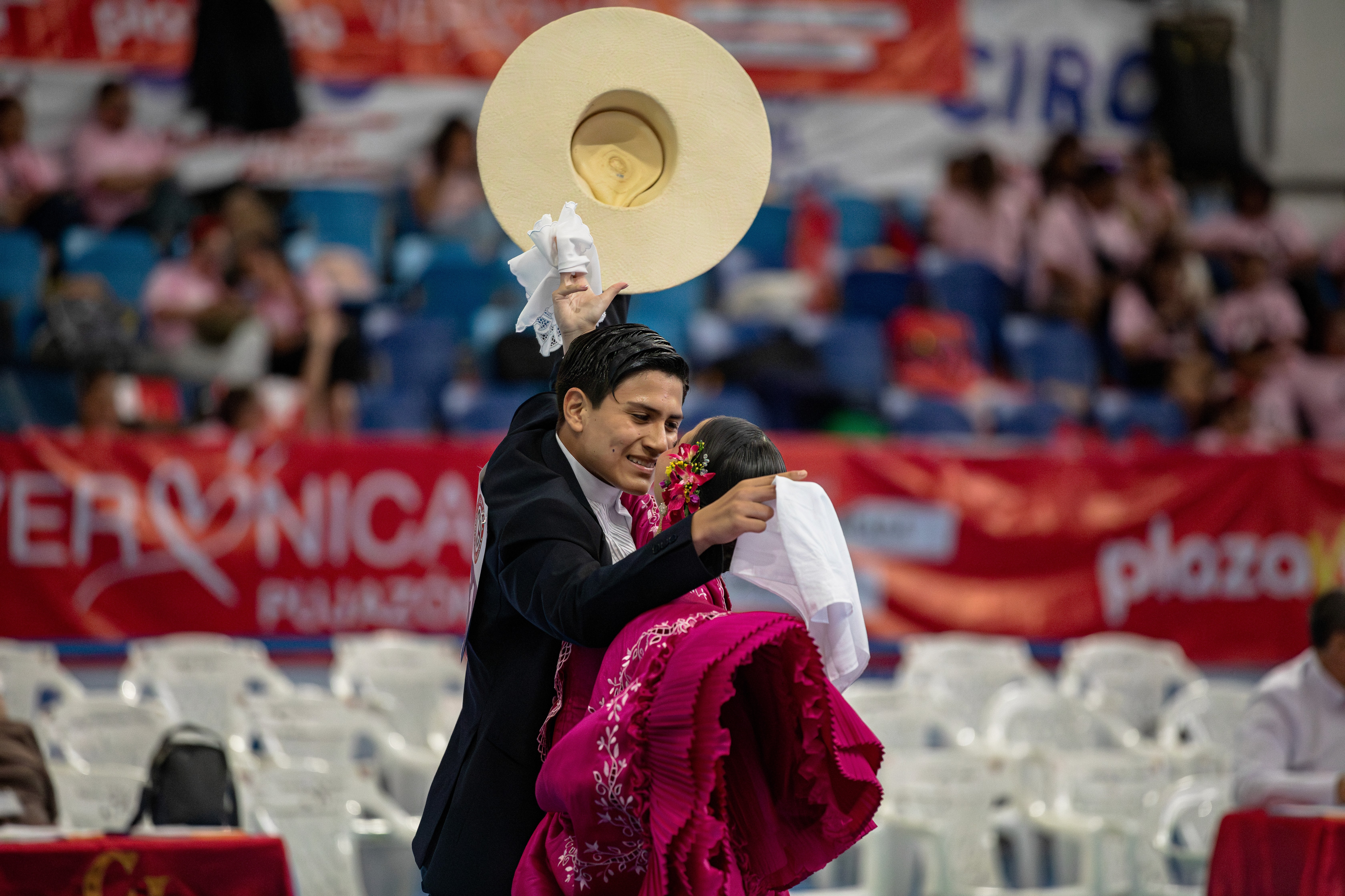 Couple performs the traditional Marinera dance during a festival in Callao, Peru.