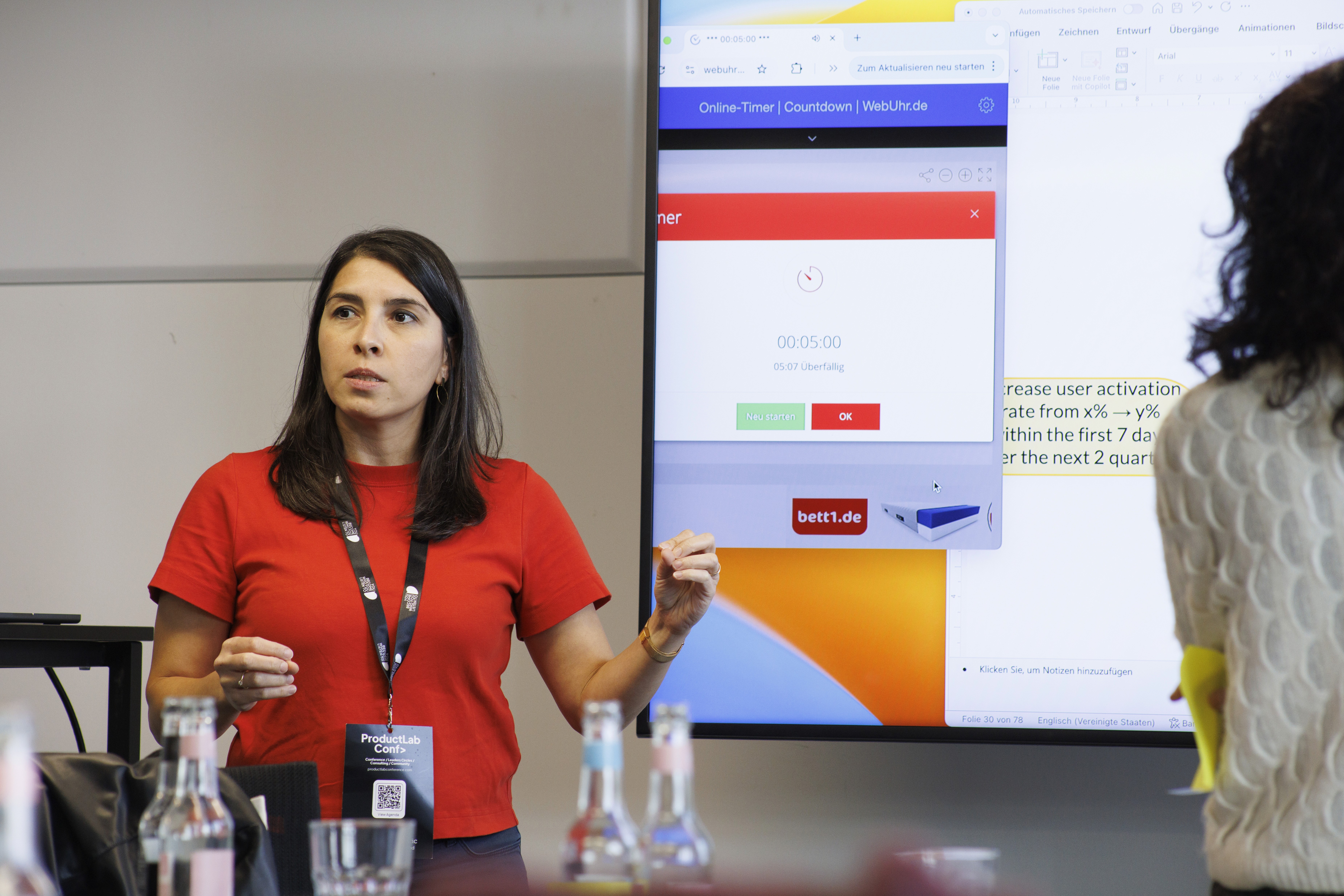 person sitting on grass and using phone