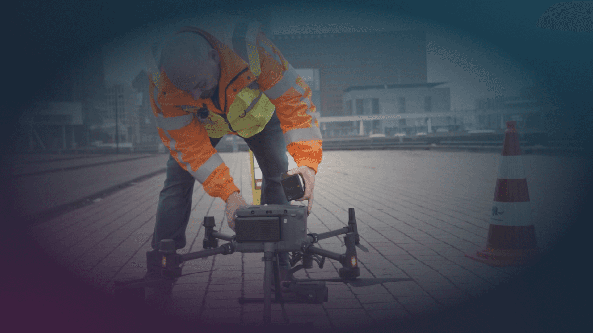 A professional drone positioned on a bridge in an urban environment, illustrating the deployment of drone technology as part of a broader counter-UAS security solution in critical infrastructure settings.