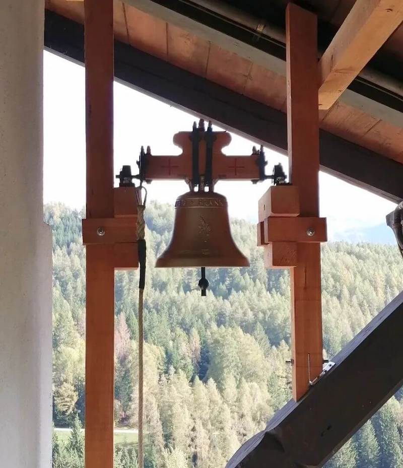 Traditional doorbell under the roof of the house