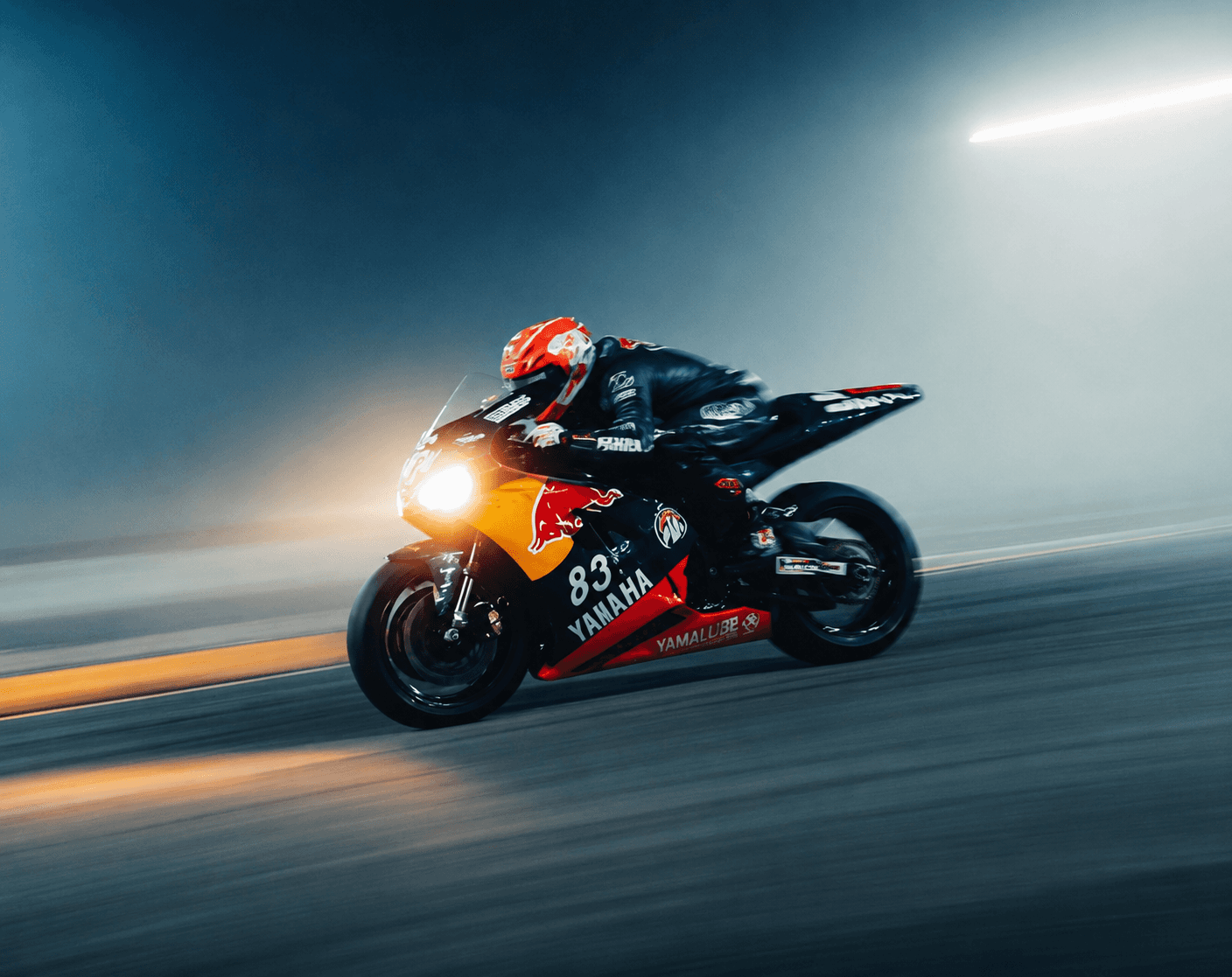 a man riding a motorcycle down a street