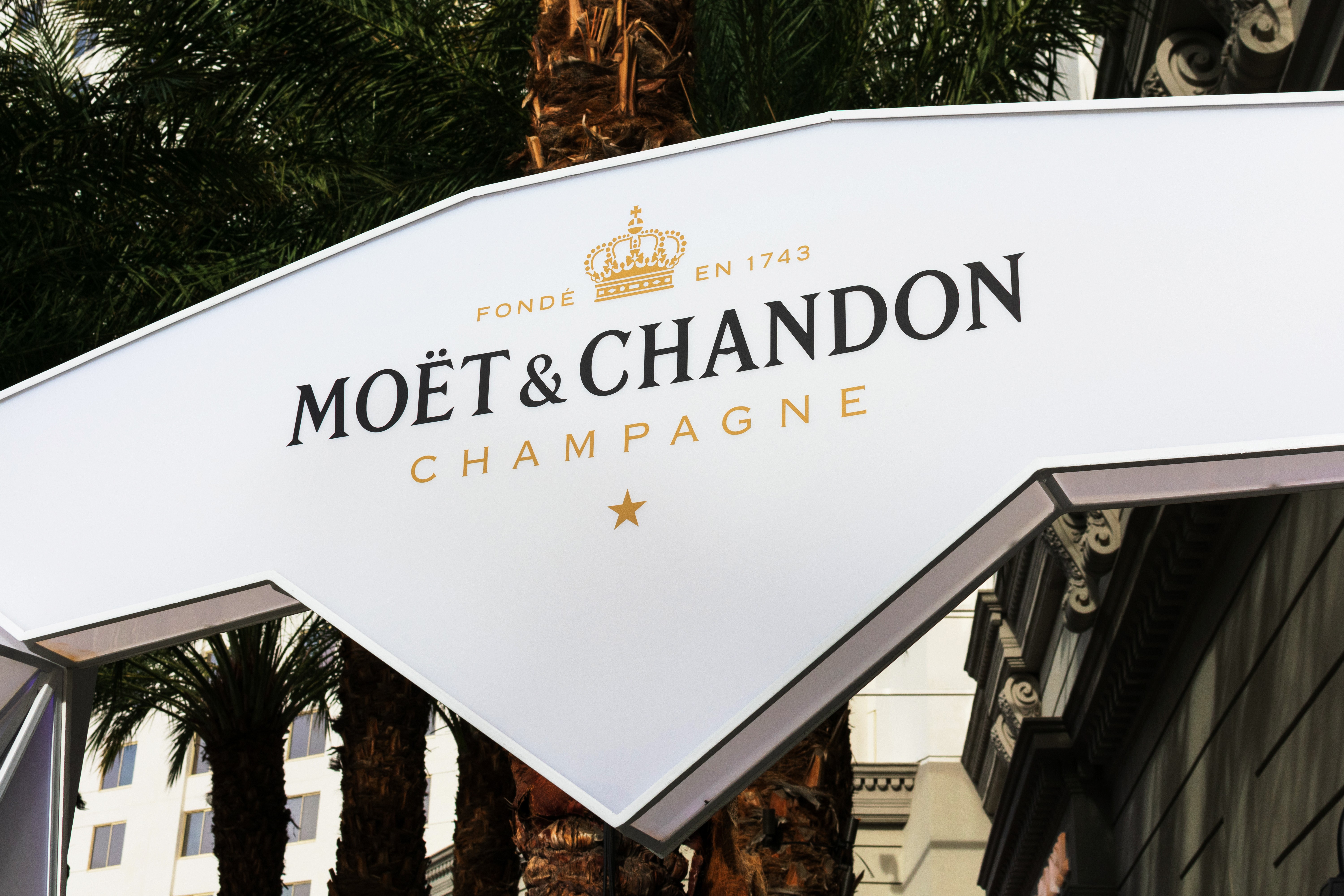 Huge white sign that says Moët & Chandon