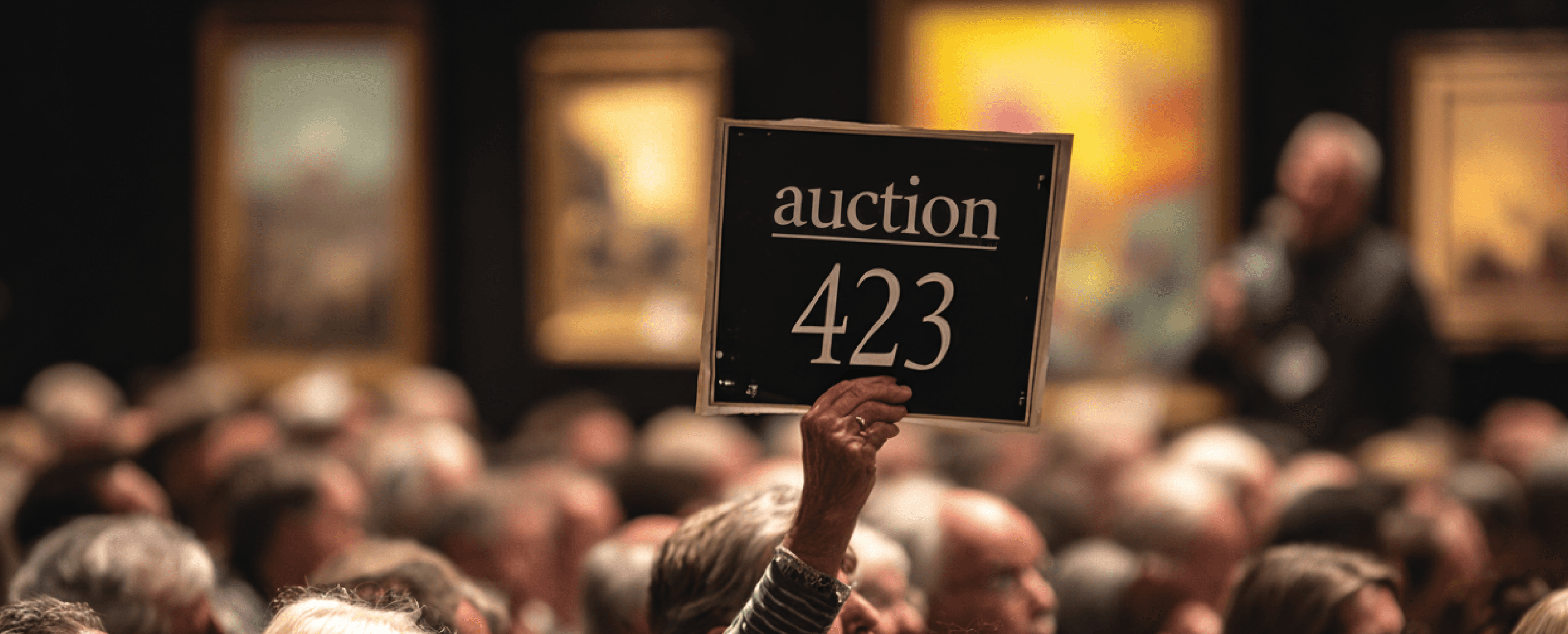 Picture of a hand raised during an auction