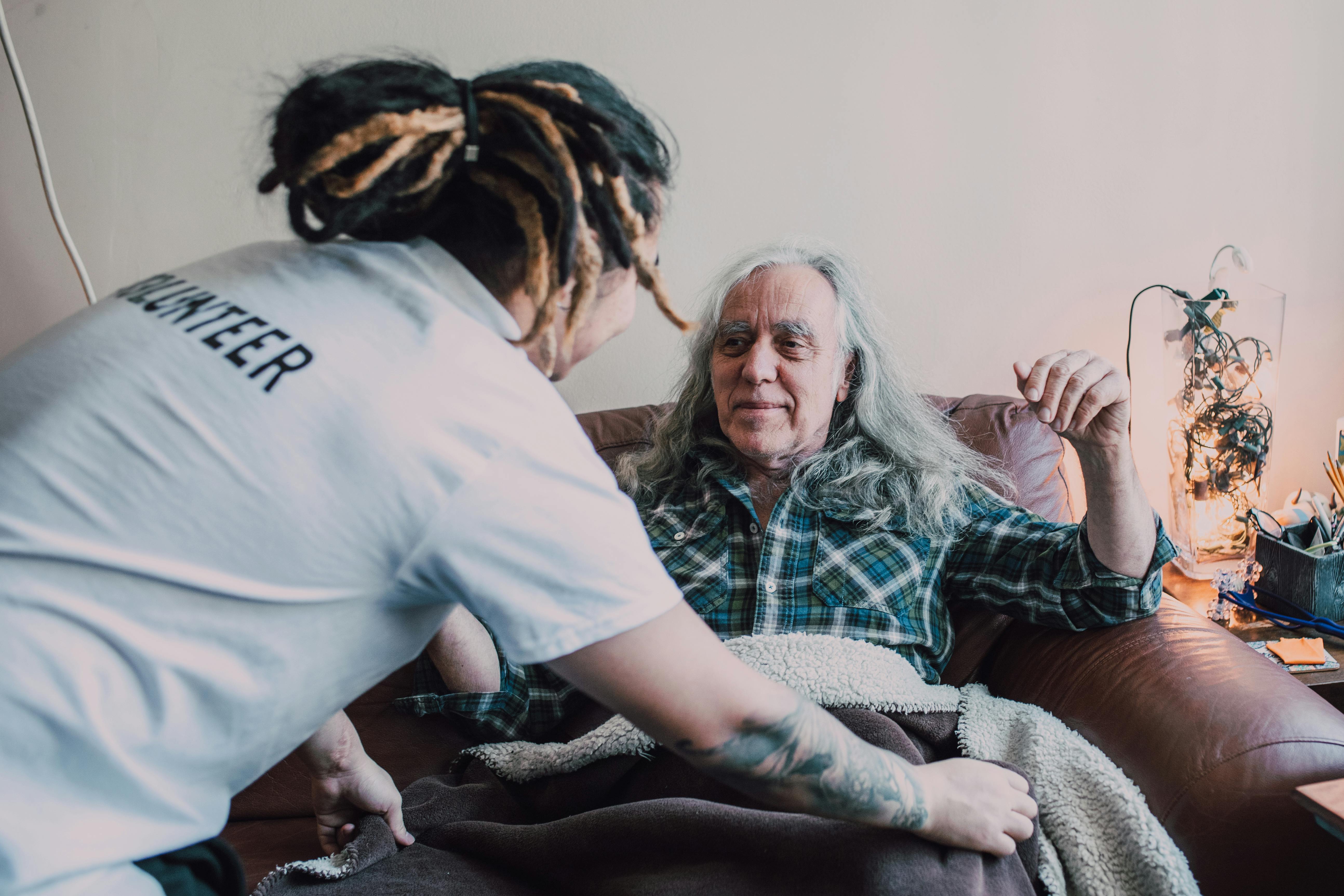 Old woman laughing with her doctor