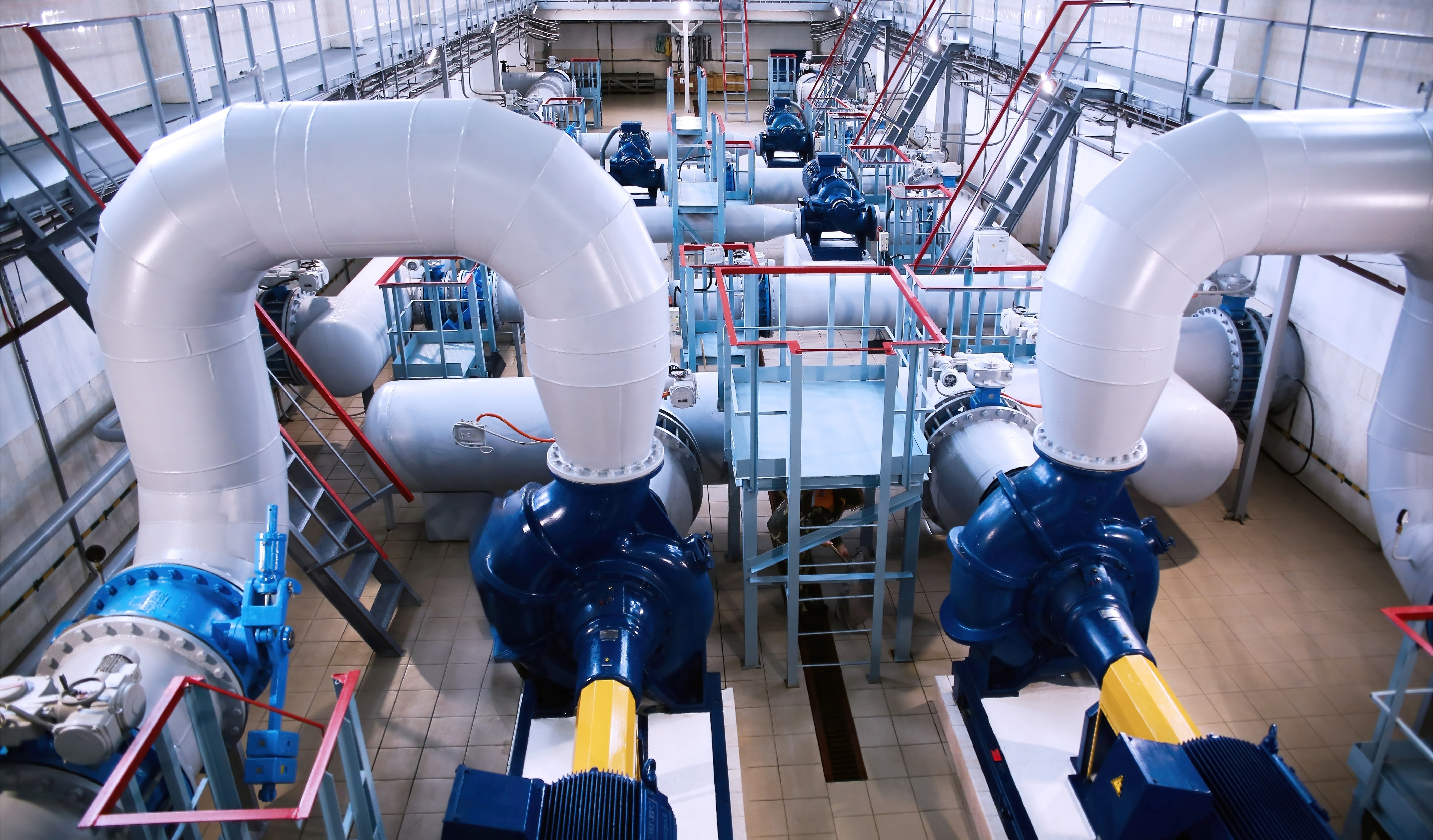 Industrial cooling system featuring glycol and water loops with pumps and heat exchangers