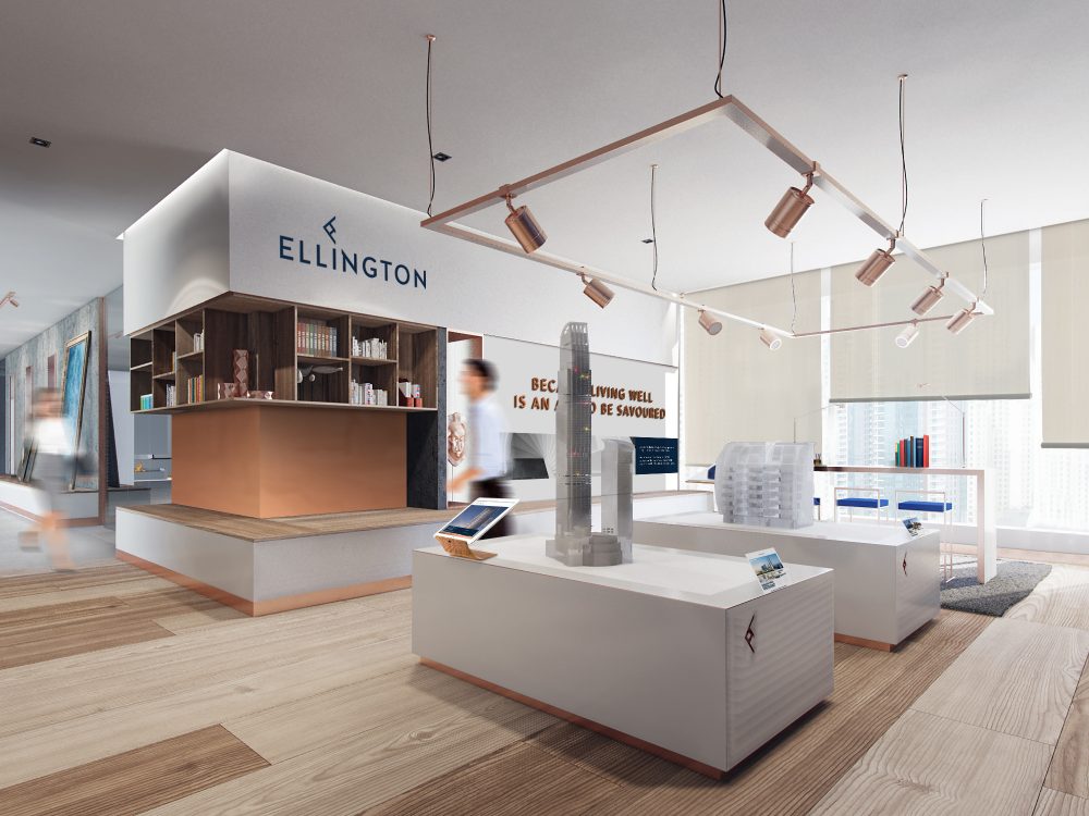 A modern real estate showroom featuring sleek display tables, architectural models, and shelves with books, set in a minimalist design that highlights contemporary lighting and branding elements.
