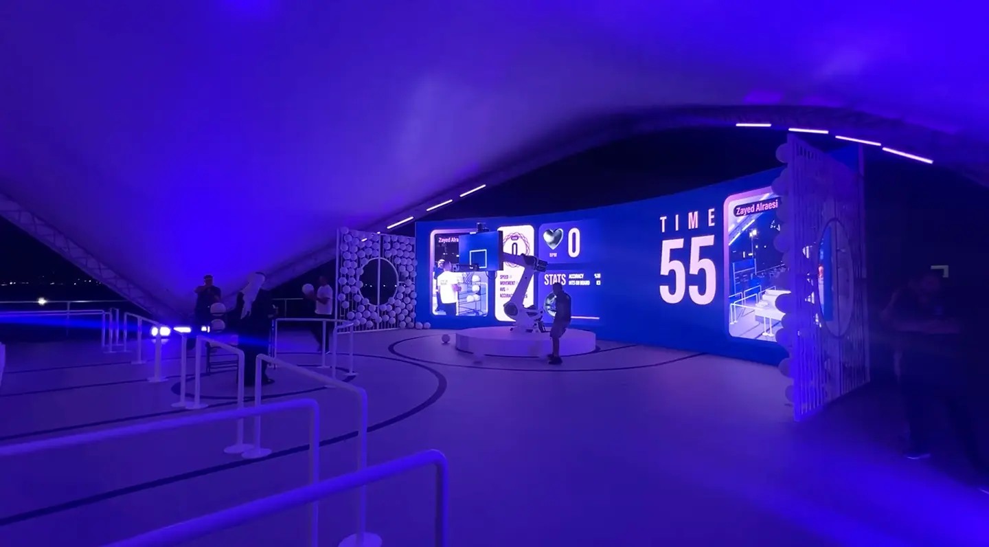 Close-up of an eye with creative makeup and white feathers.