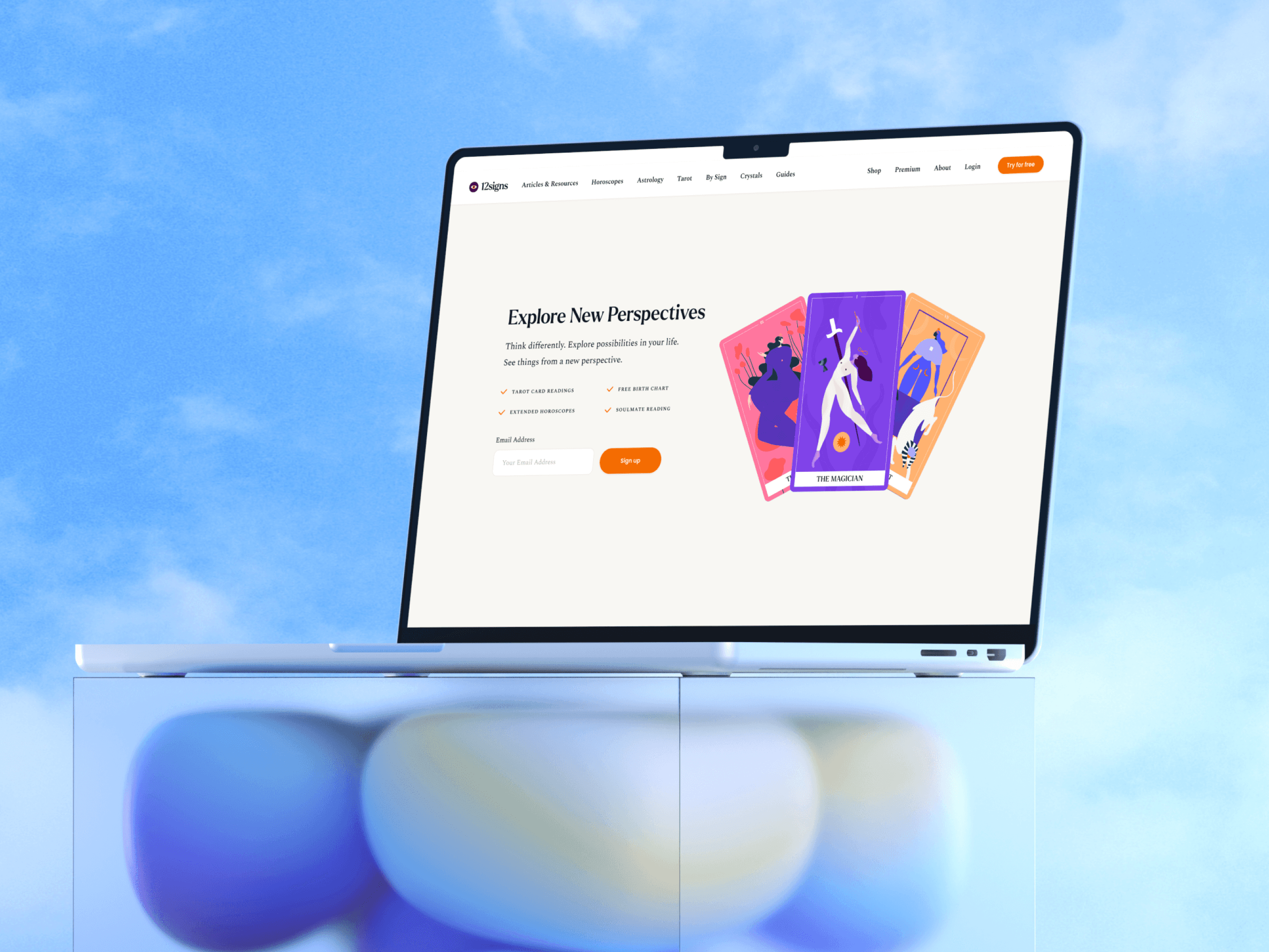 Mockup of 12Signs website on a MacBook, featuring bold tarot card illustrations — designed by Lunatique Design, set against a clear blue sky