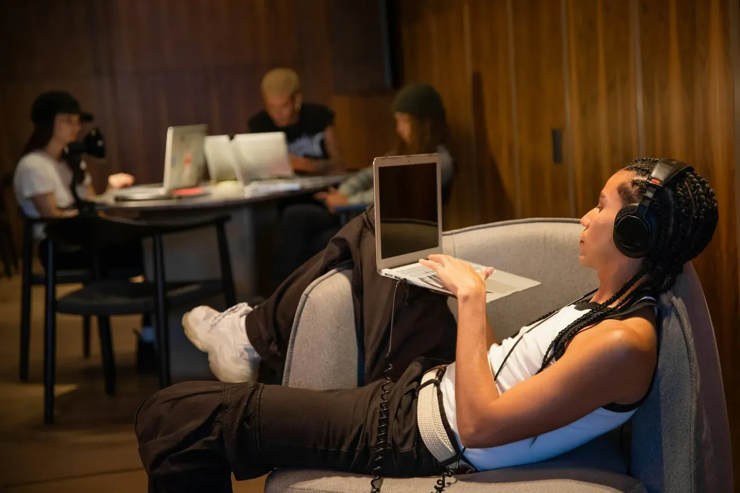 grayscale photo of person using MacBook