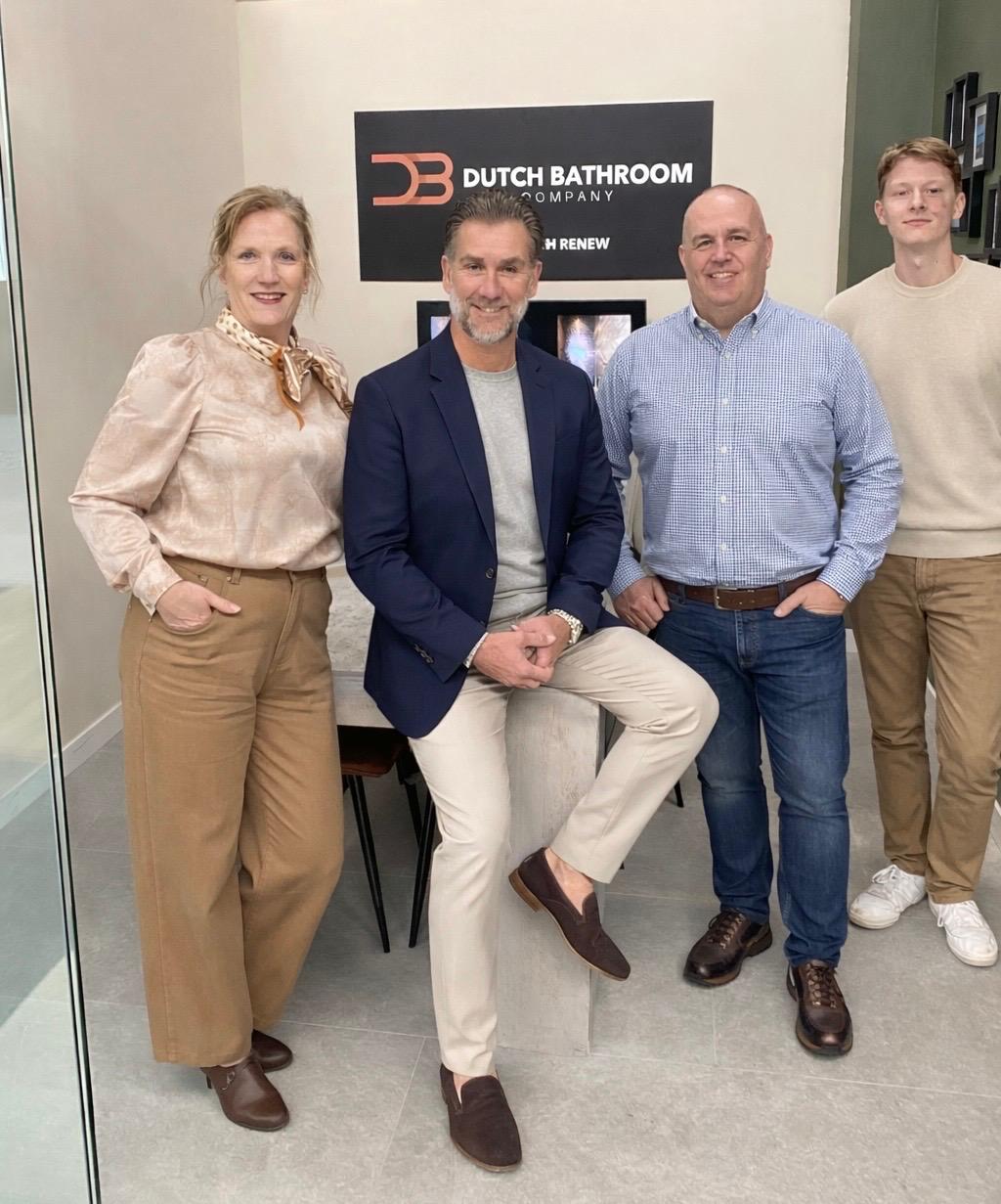Modern bathroom featuring wooden cabinetry, a bathtub, a sleek sink, and natural light from a window.