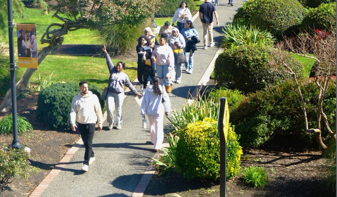 High schoolers tour a college campus.