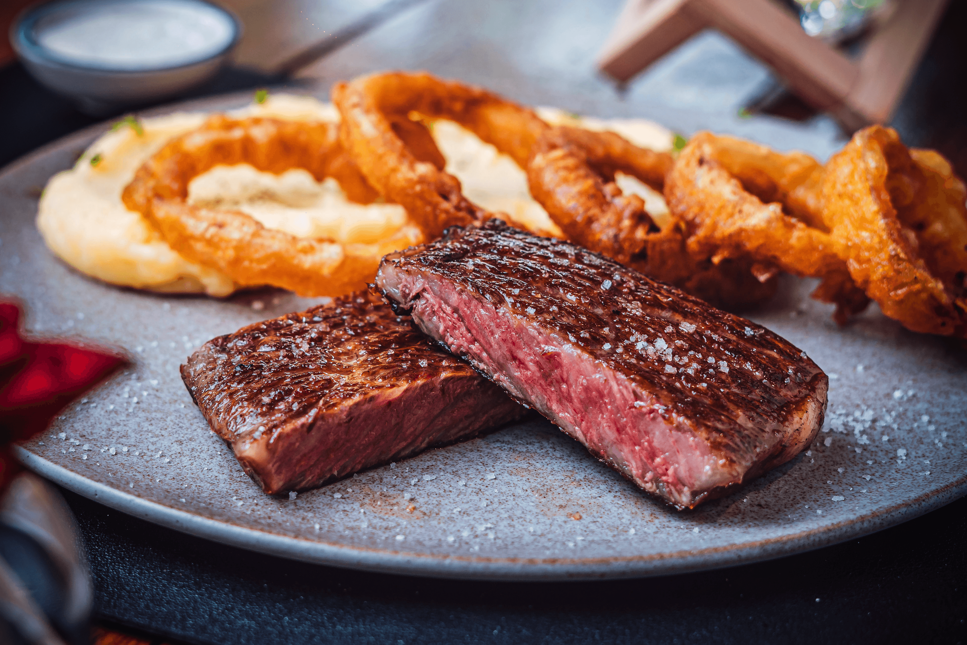 A close-up view of various baked goods on wooden plates, with warm, inviting colors and textures.