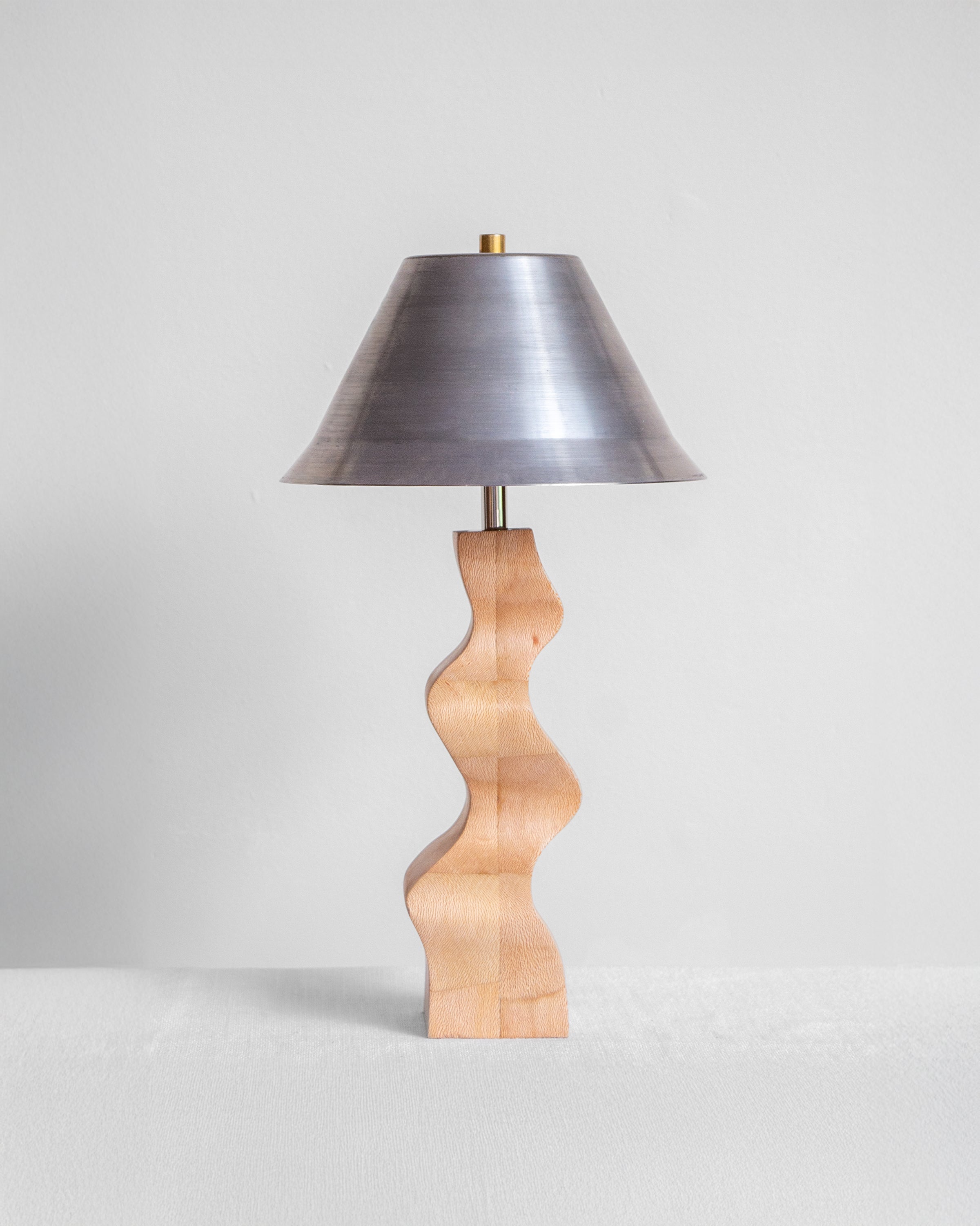 Rippled Desk Lamp with London Plane base and Raw Steel shade on a light grey background with UK, EU and US/CA wiring available on white background Wilkinson & Rivera