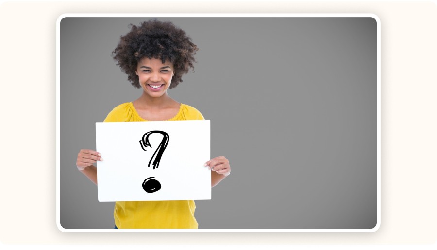 Woman holding a question mark