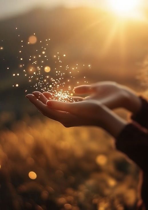Smiling female therapist with short gray hair, wearing a brown top and a purple shawl, surrounded by a cozy background.