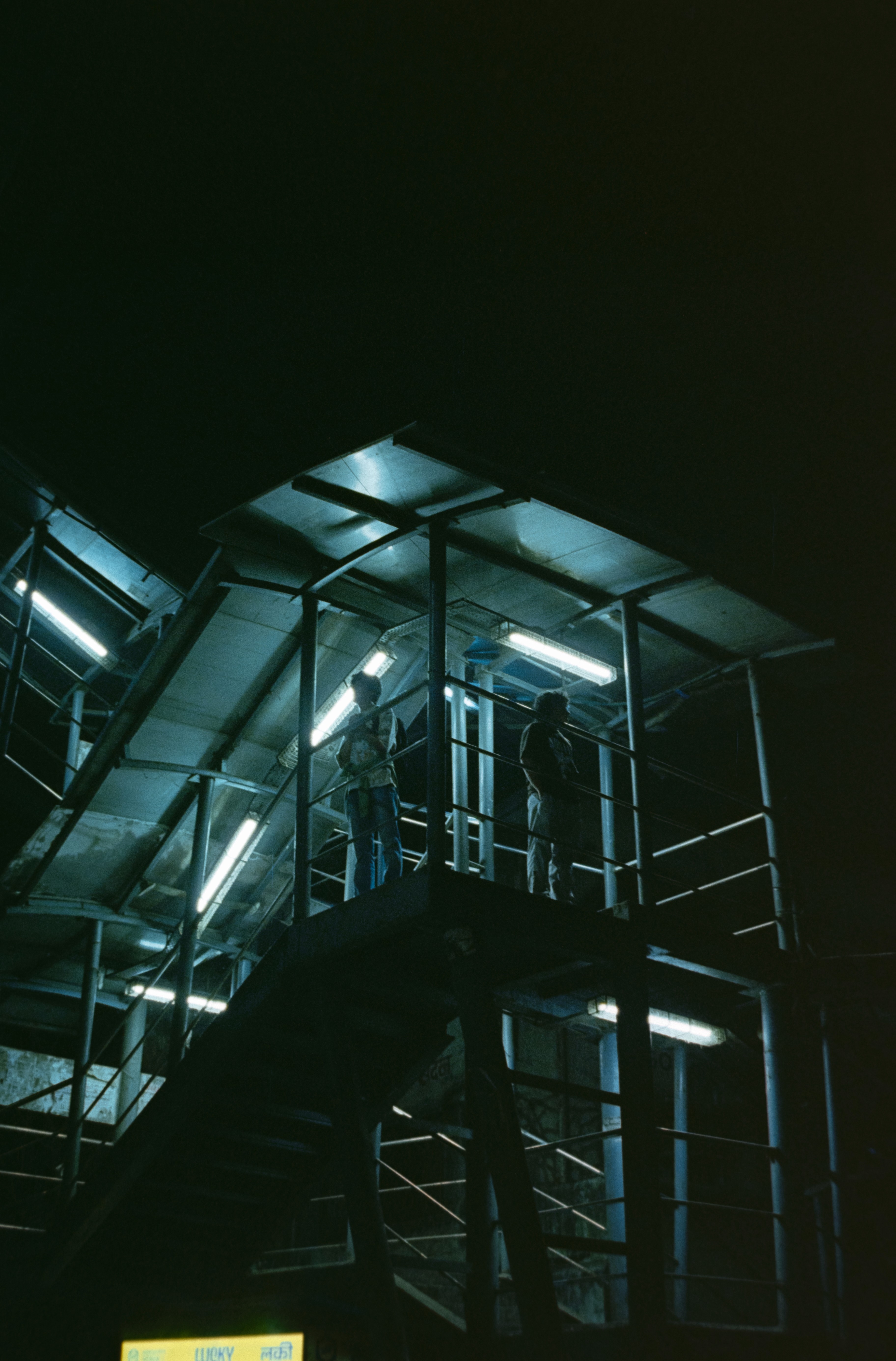 a blurry photo of a person standing in front of a wall