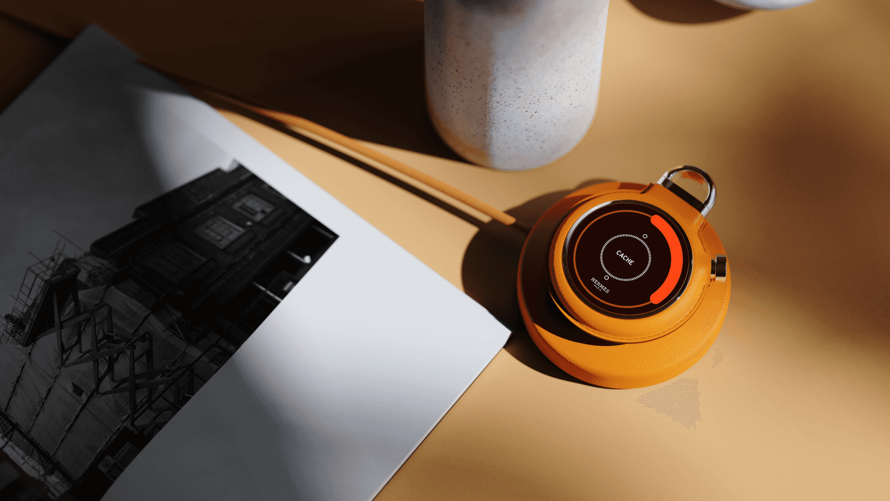 CACHE resting on its leather wireless charging pad