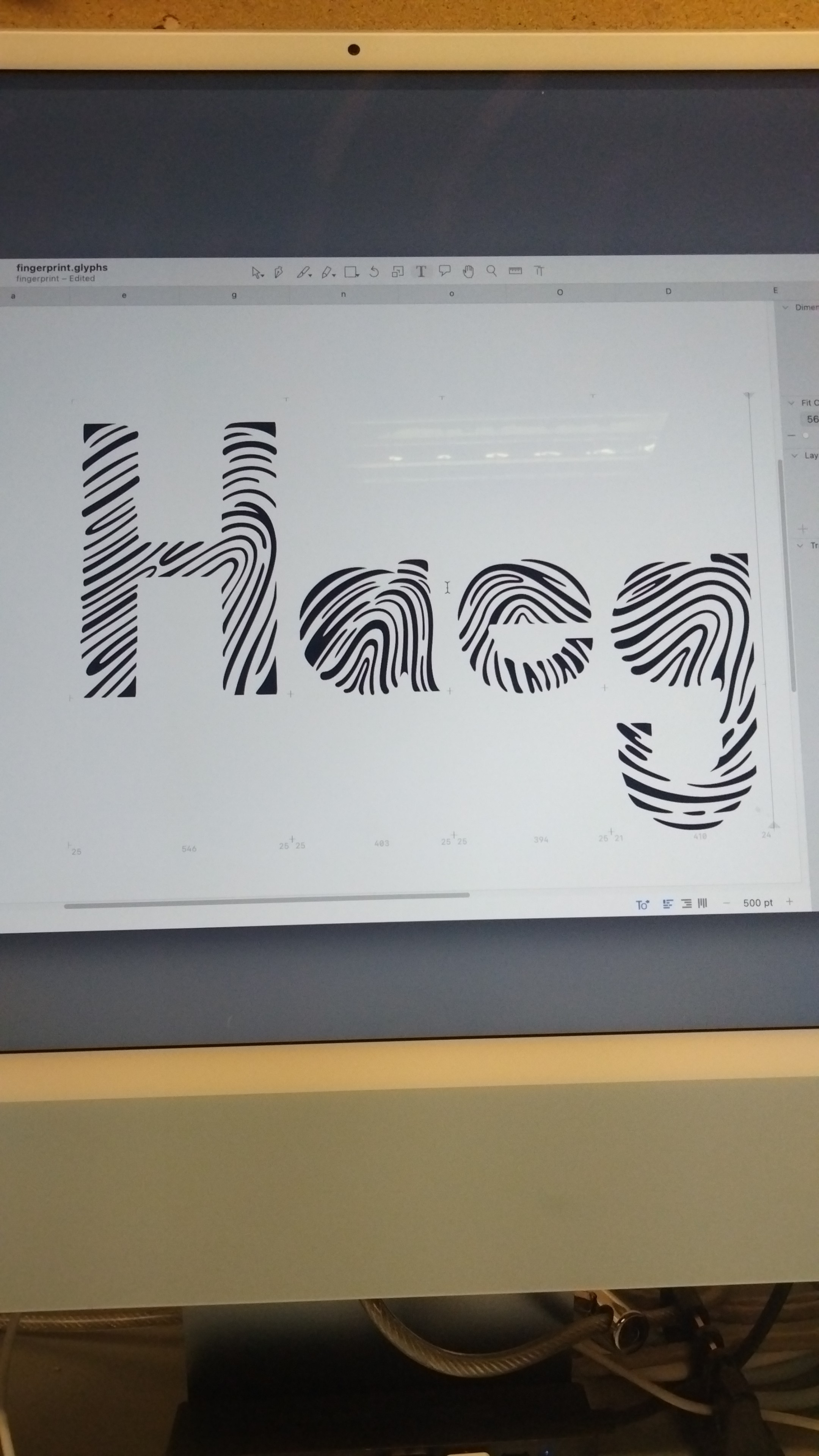 A stylized sign displays the word "Haeg" in gray lettering on a white background.