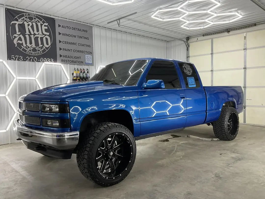 Shiny Blue truck in a detailing shop