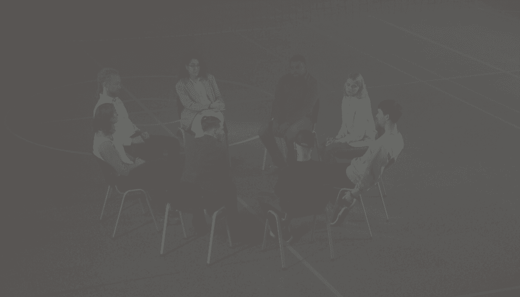 Layered angular wooden panels with warm accent lighting.