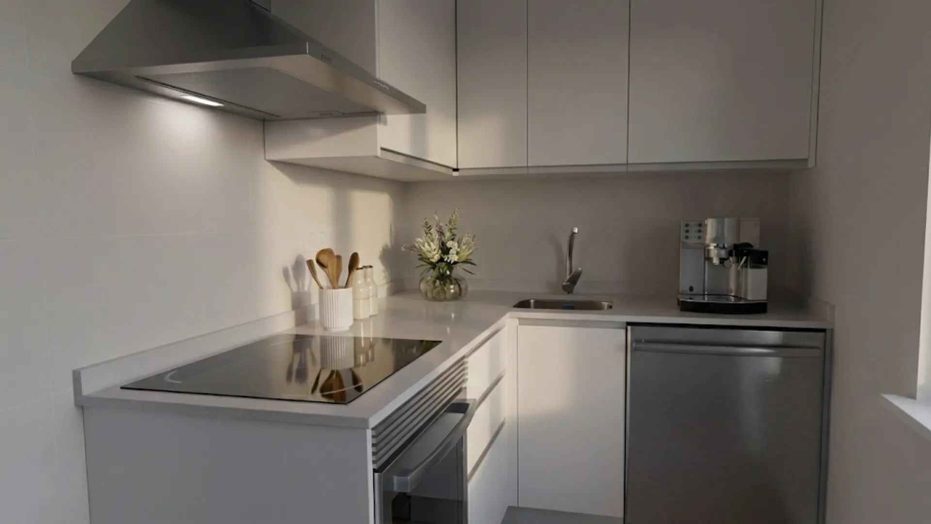 Modern hotel lobby with sleek reception desk and seating.