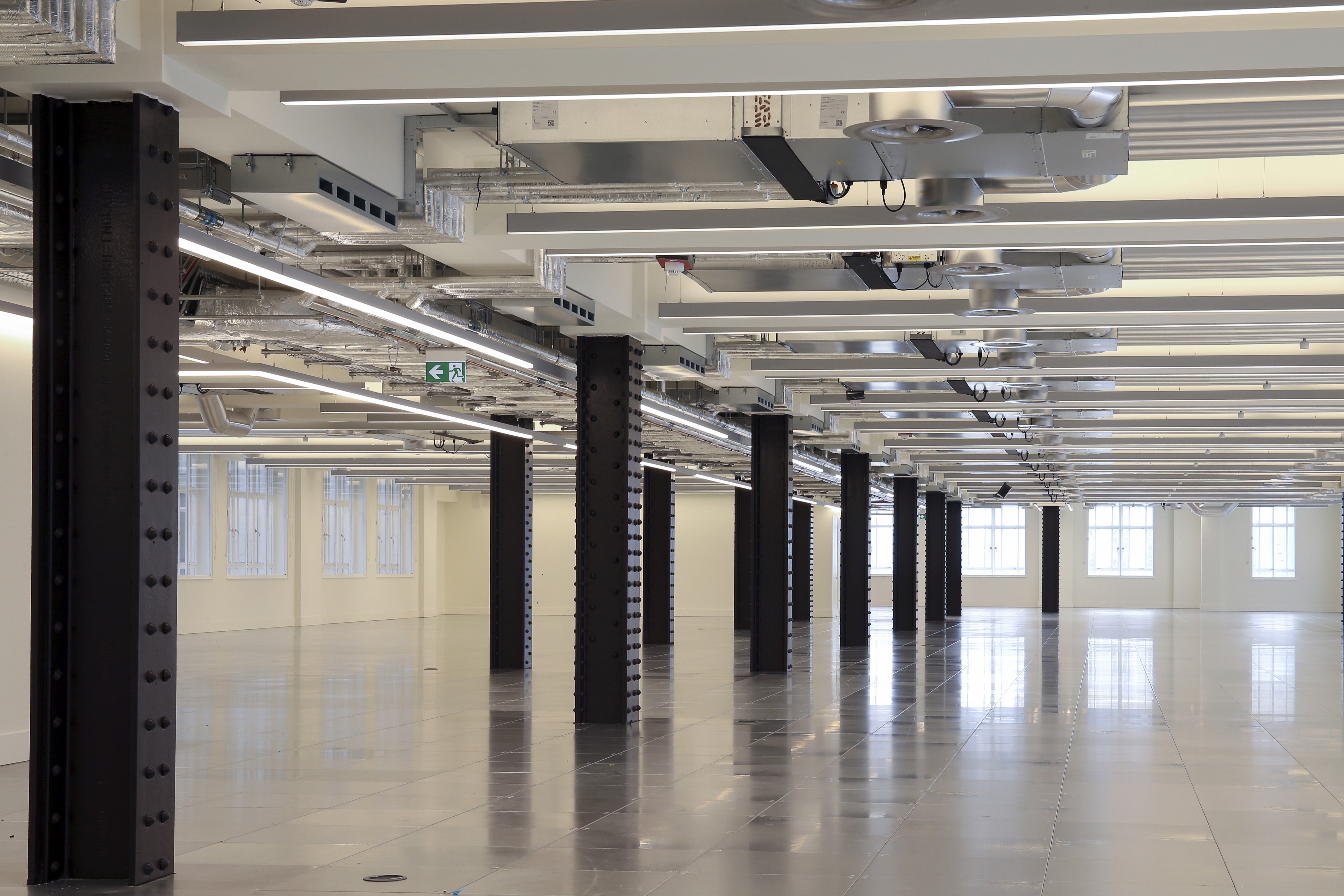 Futuristic residential architecture with cantilevered orange sections and integrated green spaces, reflecting the architect's innovative vision