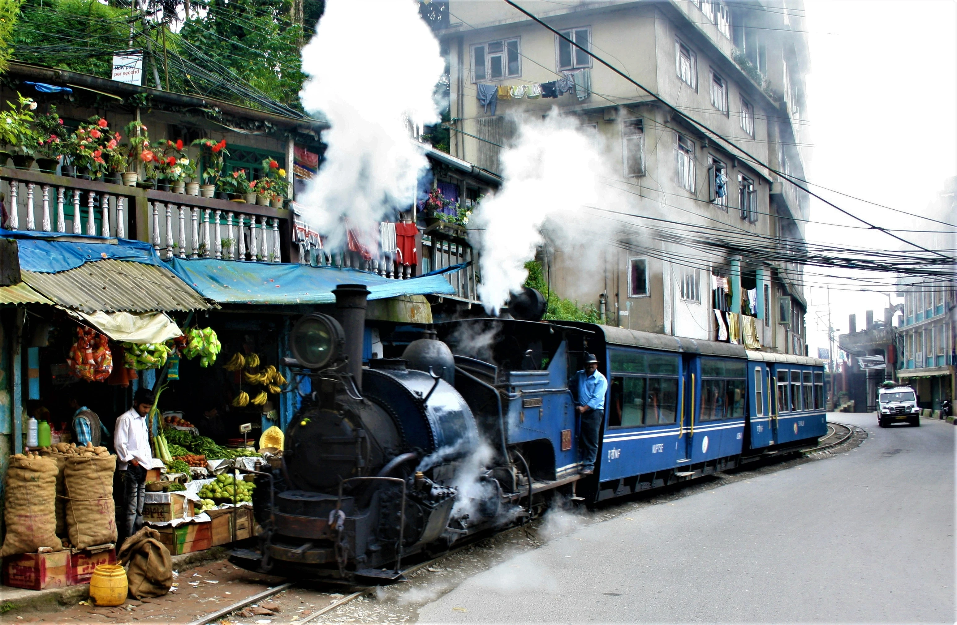 Steam train through town