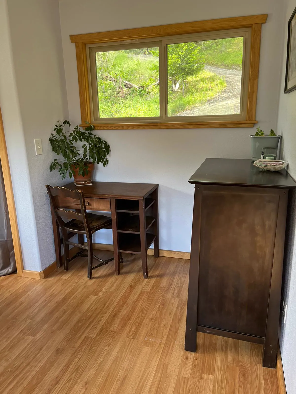 Private studio workspace at Dark Fairy Farm with a desk beneath a window.