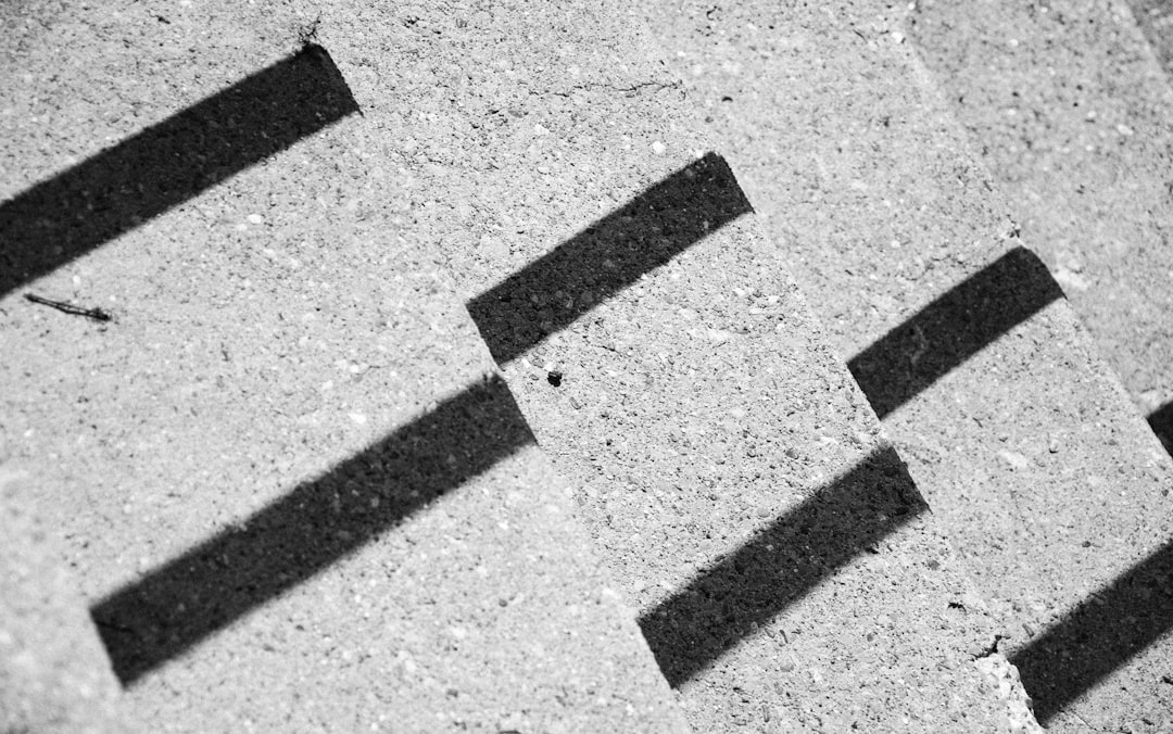 Cinematic grainy texture detail used for atmospheric author branding.