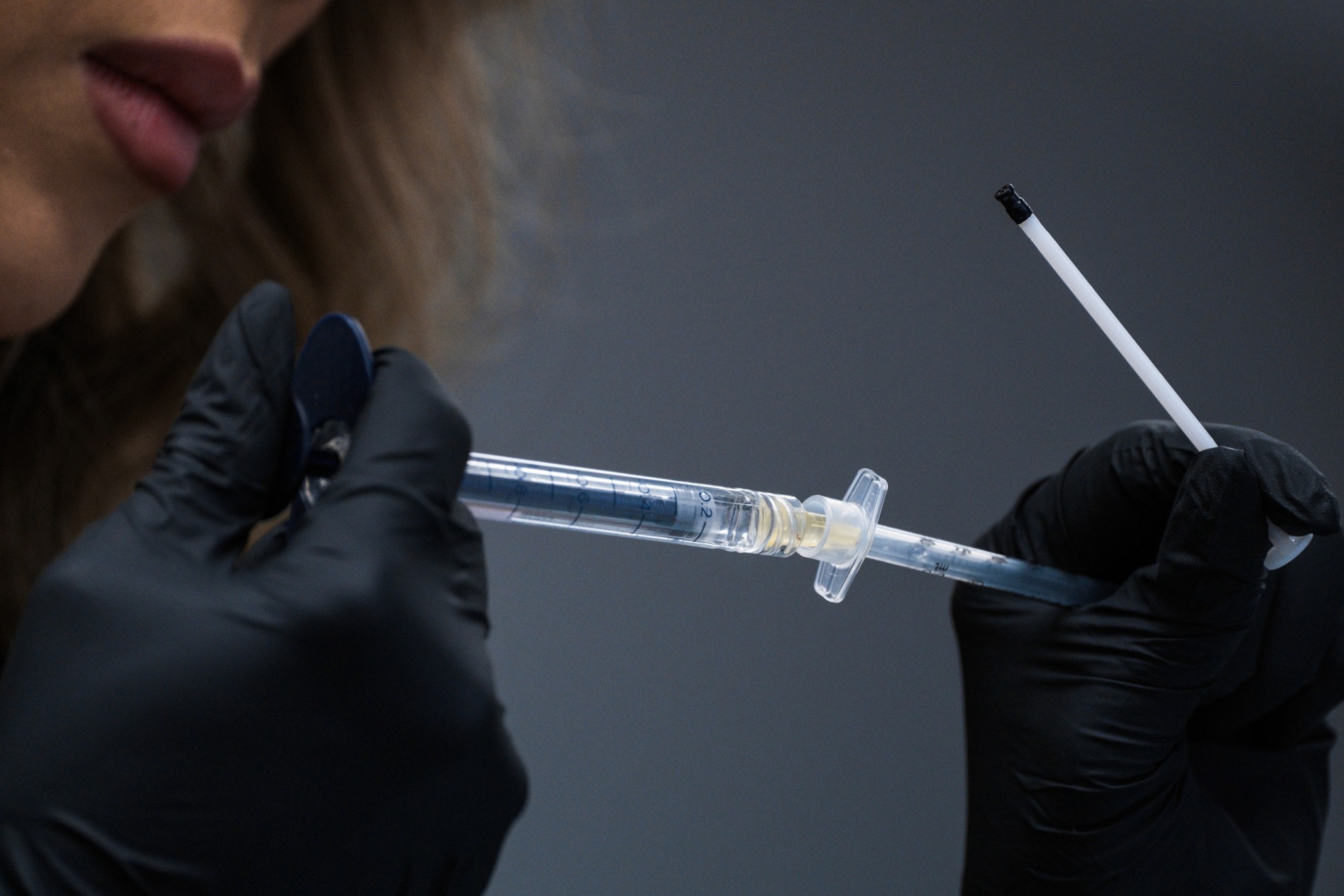 Beautician preparing the syringes for the injections