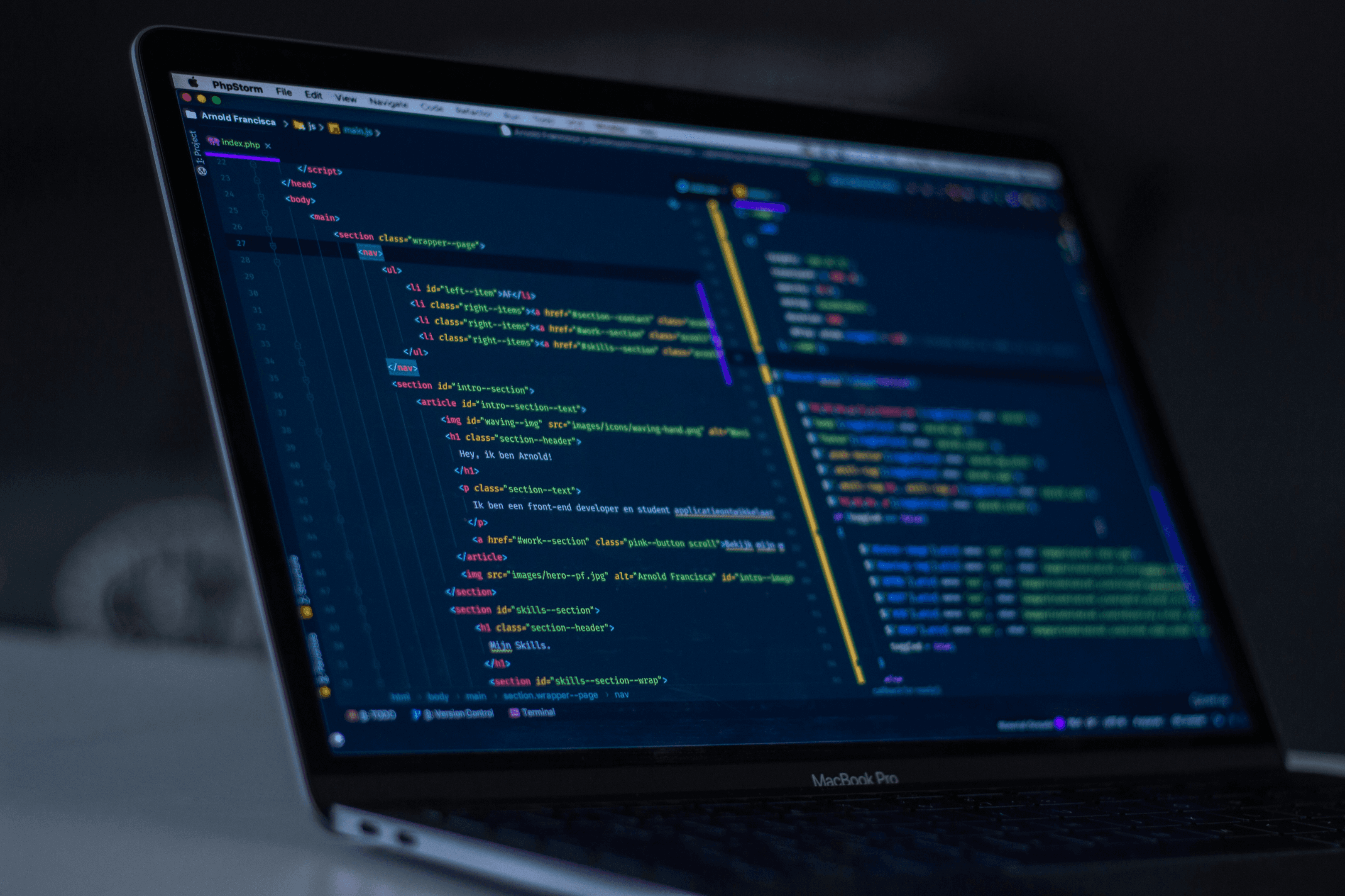 MacBook with lines of code