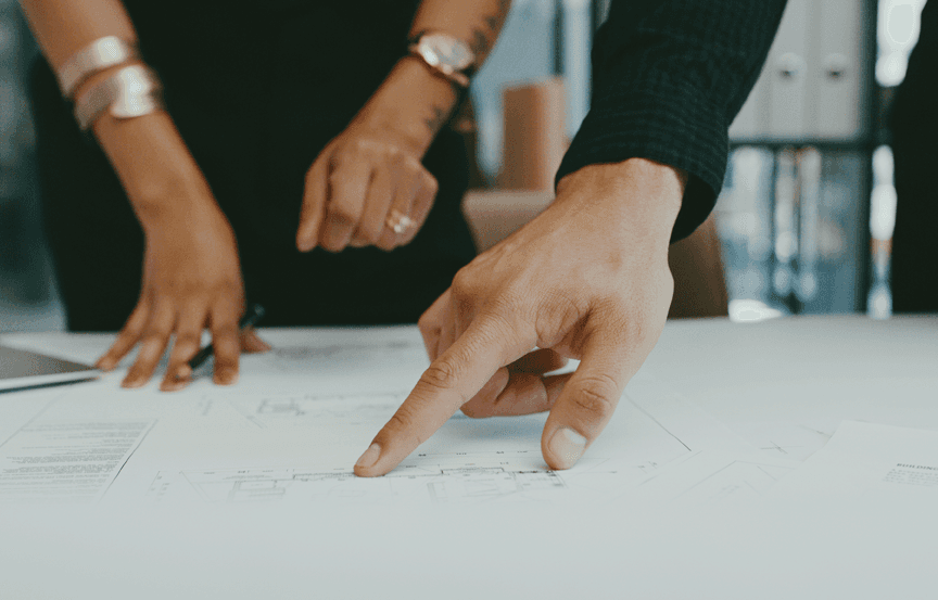 Physician speaking with a patient, representing the in-depth interviews and dyads Public Works uses to understand lived experience and inform human-centered design