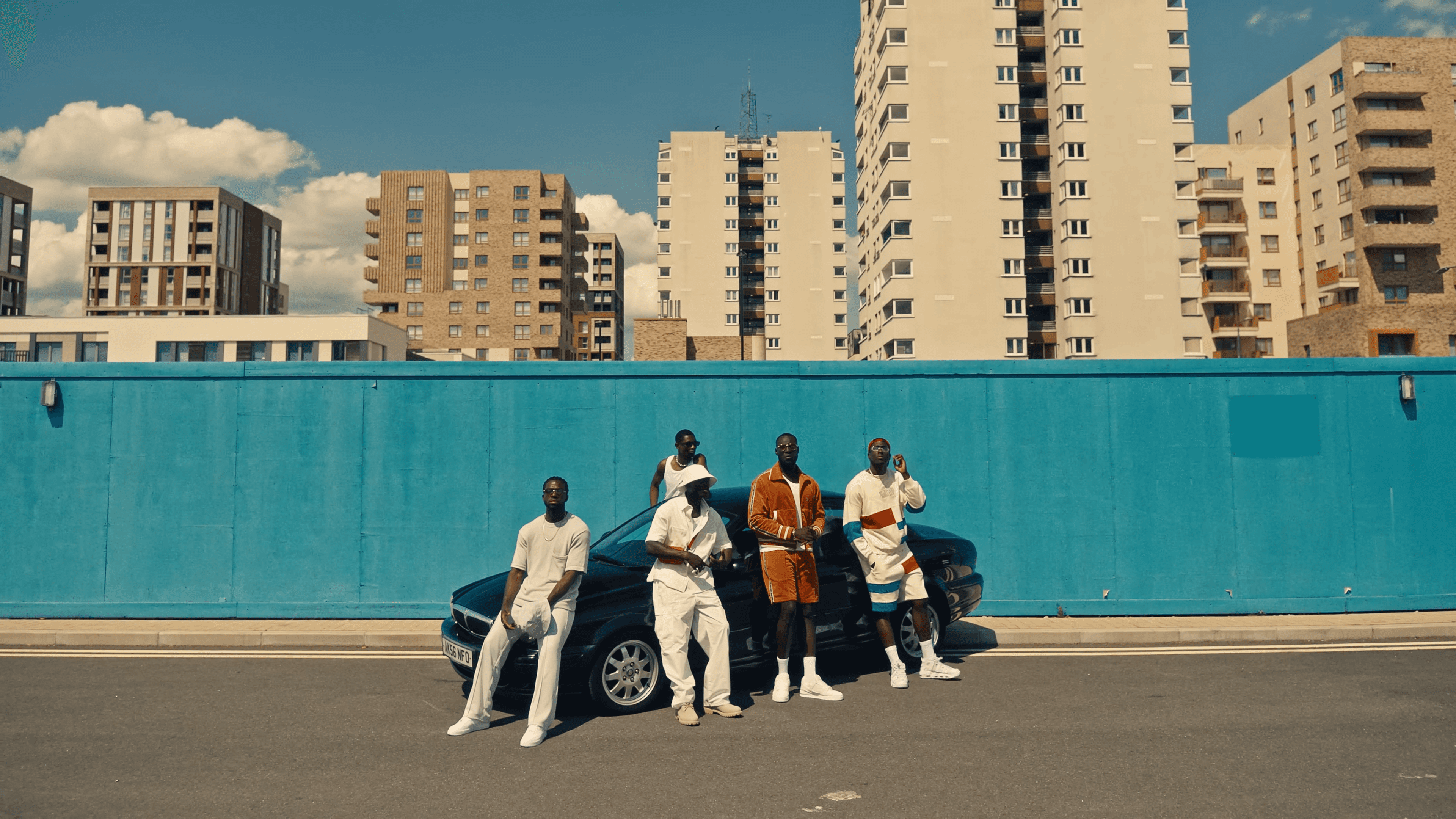 A person stands on steps with hair covering face.