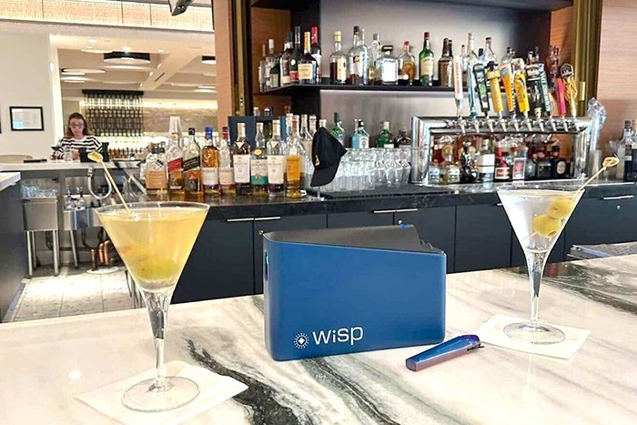 WiSP has developed a small, reusable device paired with an app that instantly scans drinks for drugs and alcohol content. Courtesy.