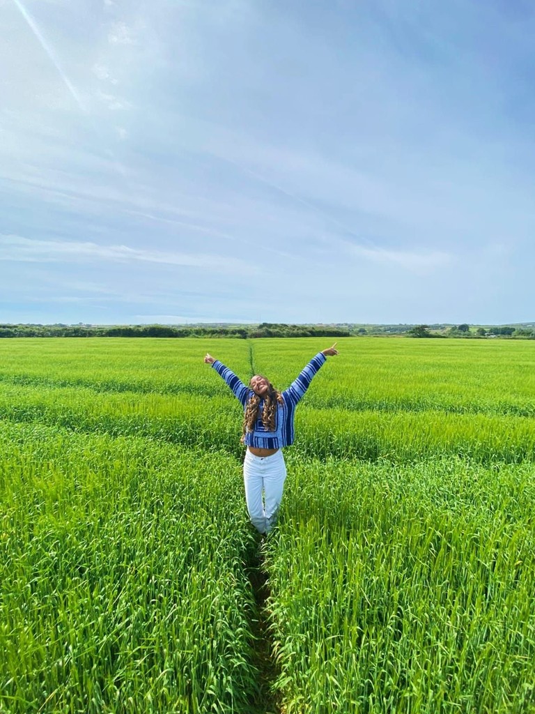 rita batalha in a grass field