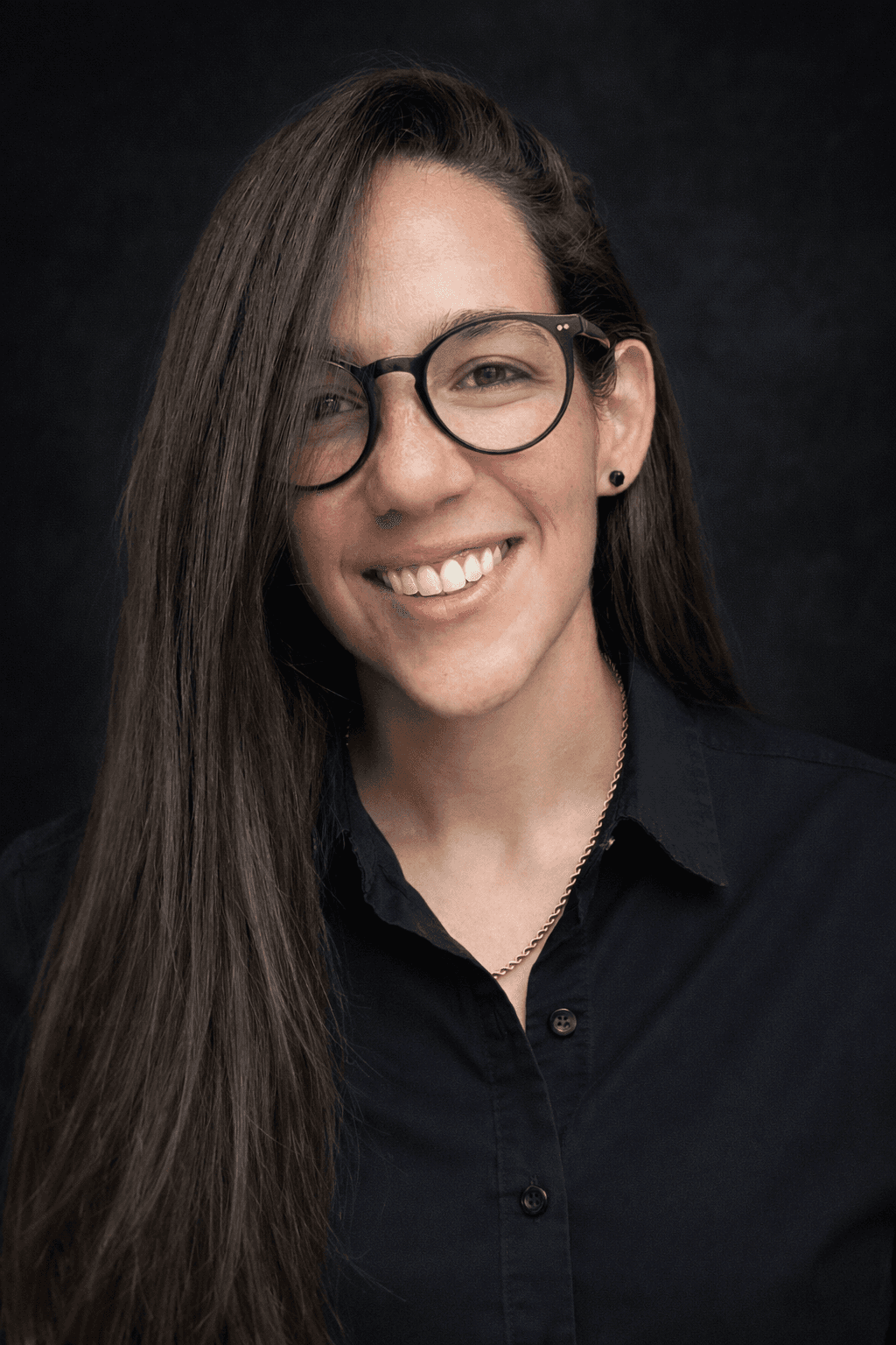 image of a woman wearing a black shirt and glasses
