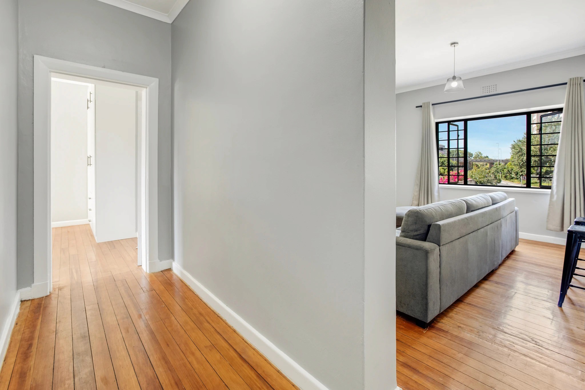 Renovated apartment interior with wooden floors at Letterstedt Court, Newlands.
