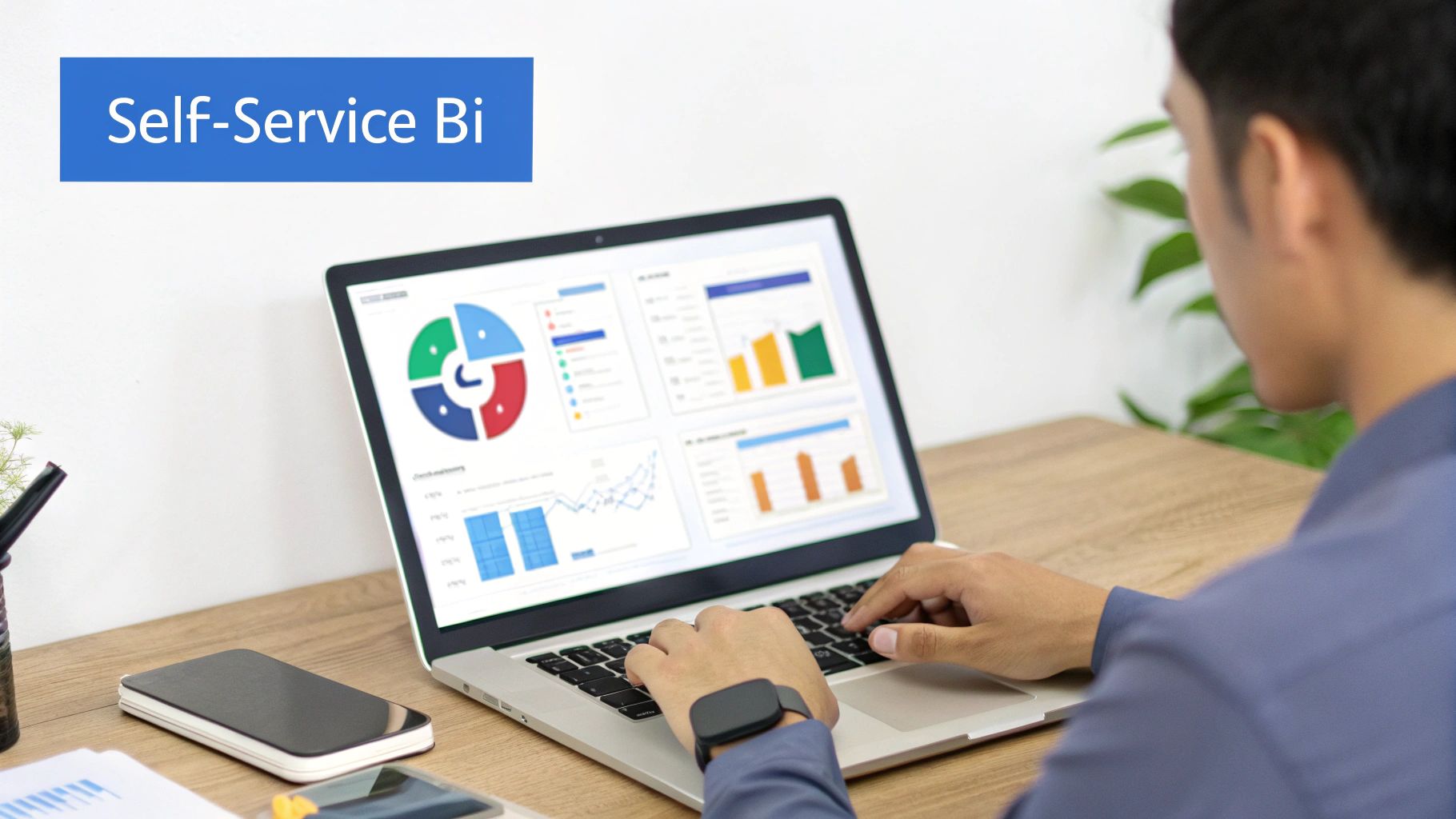 A person is working on a laptop displaying data visualization charts and graphs, with 