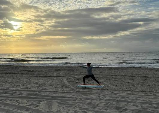 Morning yoga by the beach
