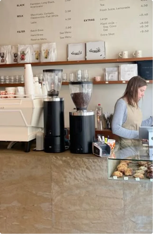 Barista working behind coffee bar
